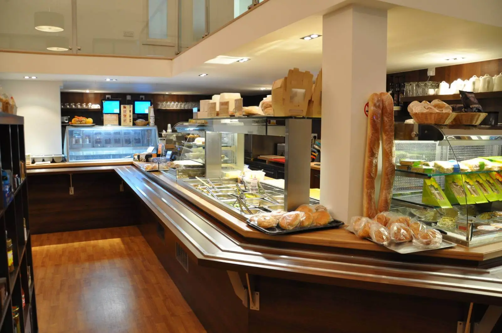 Vanilla Bazaar office space with designer furniture, laminated wood flooring, ceiling and glass partitions 4