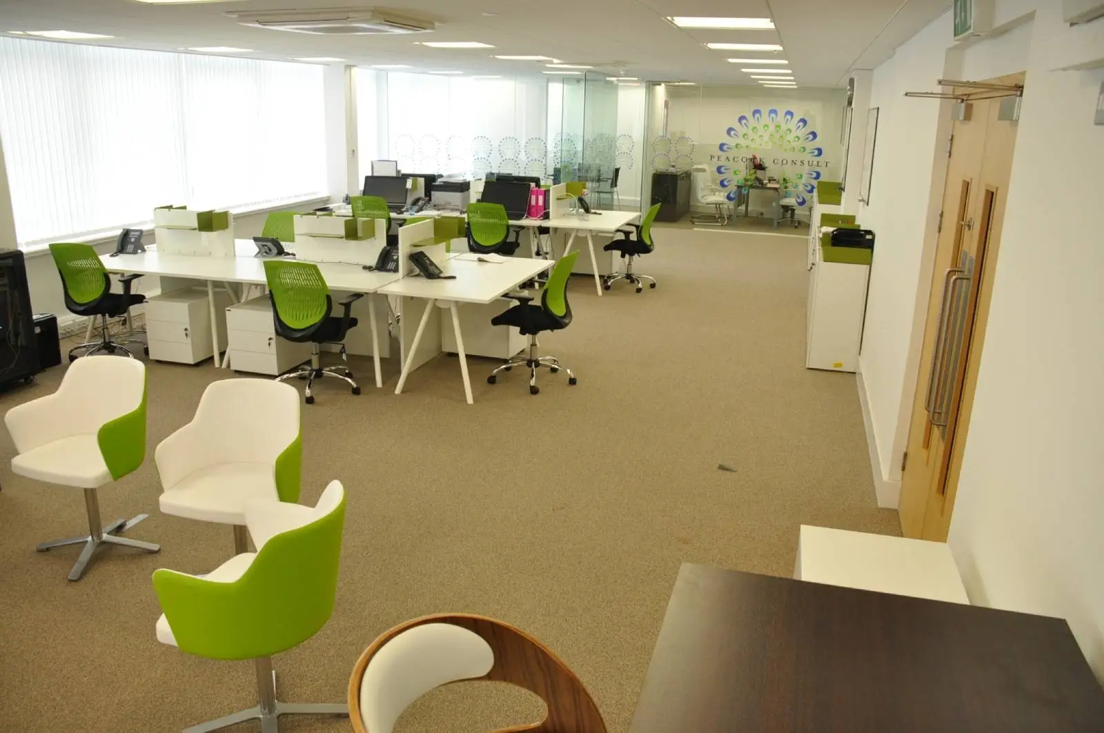 Corinthain House office space design with designer furniture, suspended grid ceiling, carpet tile flooring and glass partitions 1
