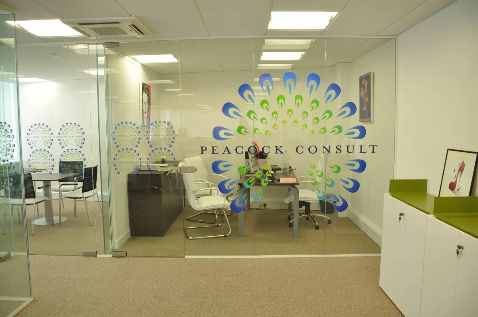 Corinthain House office space design with designer furniture, suspended grid ceiling, carpet tile flooring and glass partitions 14