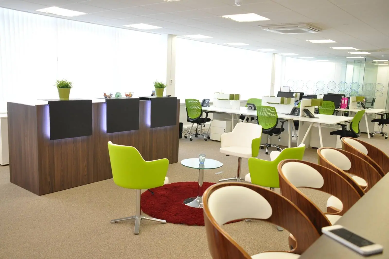 Corinthain House office space design with designer furniture, suspended grid ceiling, carpet tile flooring and glass partitions 17