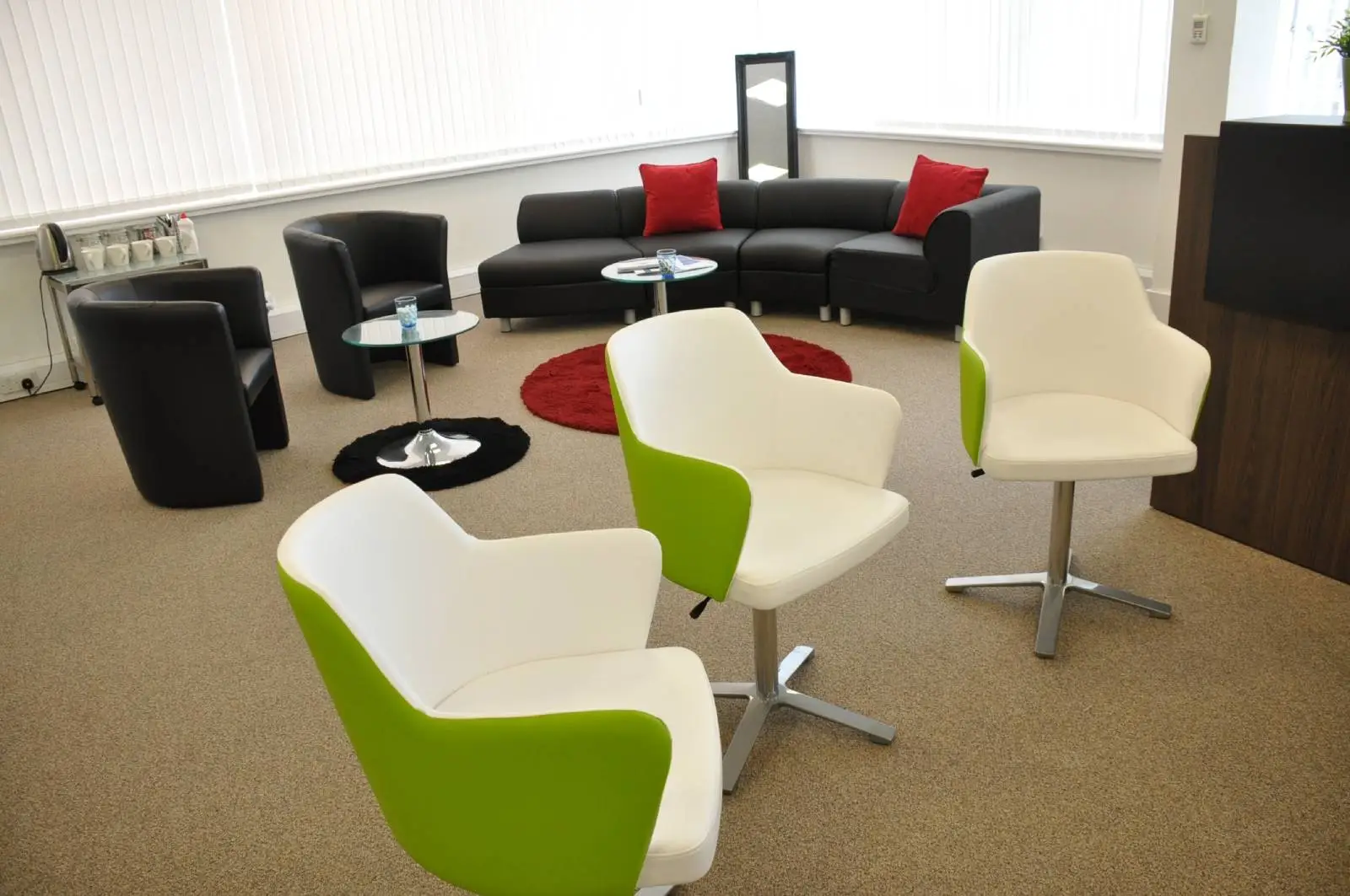 Corinthain House office space design with designer furniture, suspended grid ceiling, carpet tile flooring and glass partitions 2