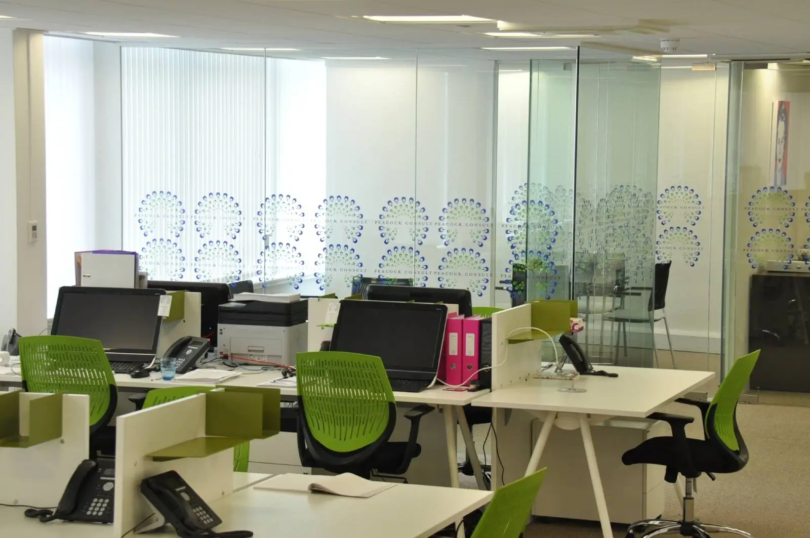 Corinthain House office space design with designer furniture, suspended grid ceiling, carpet tile flooring and glass partitions 6