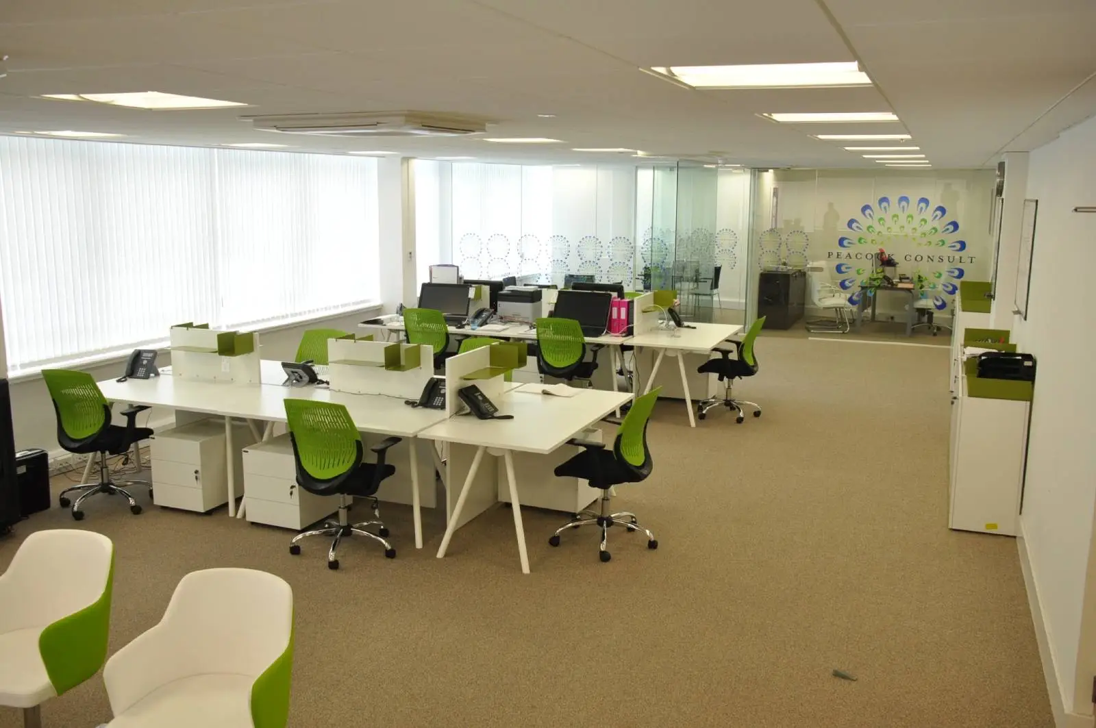 Corinthain House office space design with designer furniture, suspended grid ceiling, carpet tile flooring and glass partitions 7