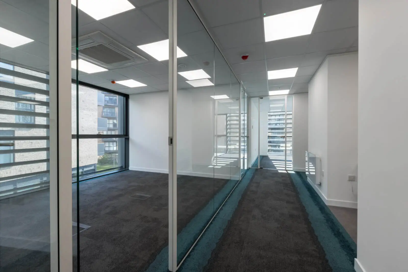 Godleys office space design with designer furniture and single glazed framed glass partitions 3