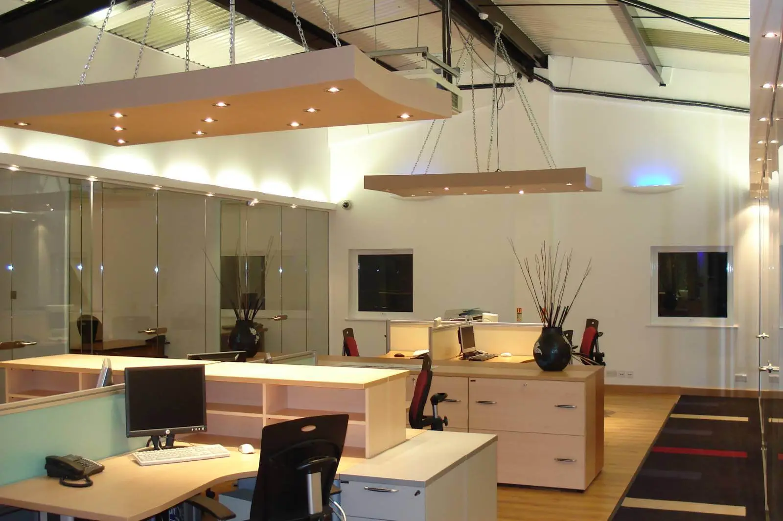 GXI office unit D space design with designer furniture, along with flooring, ceiling, and glass partitions 10