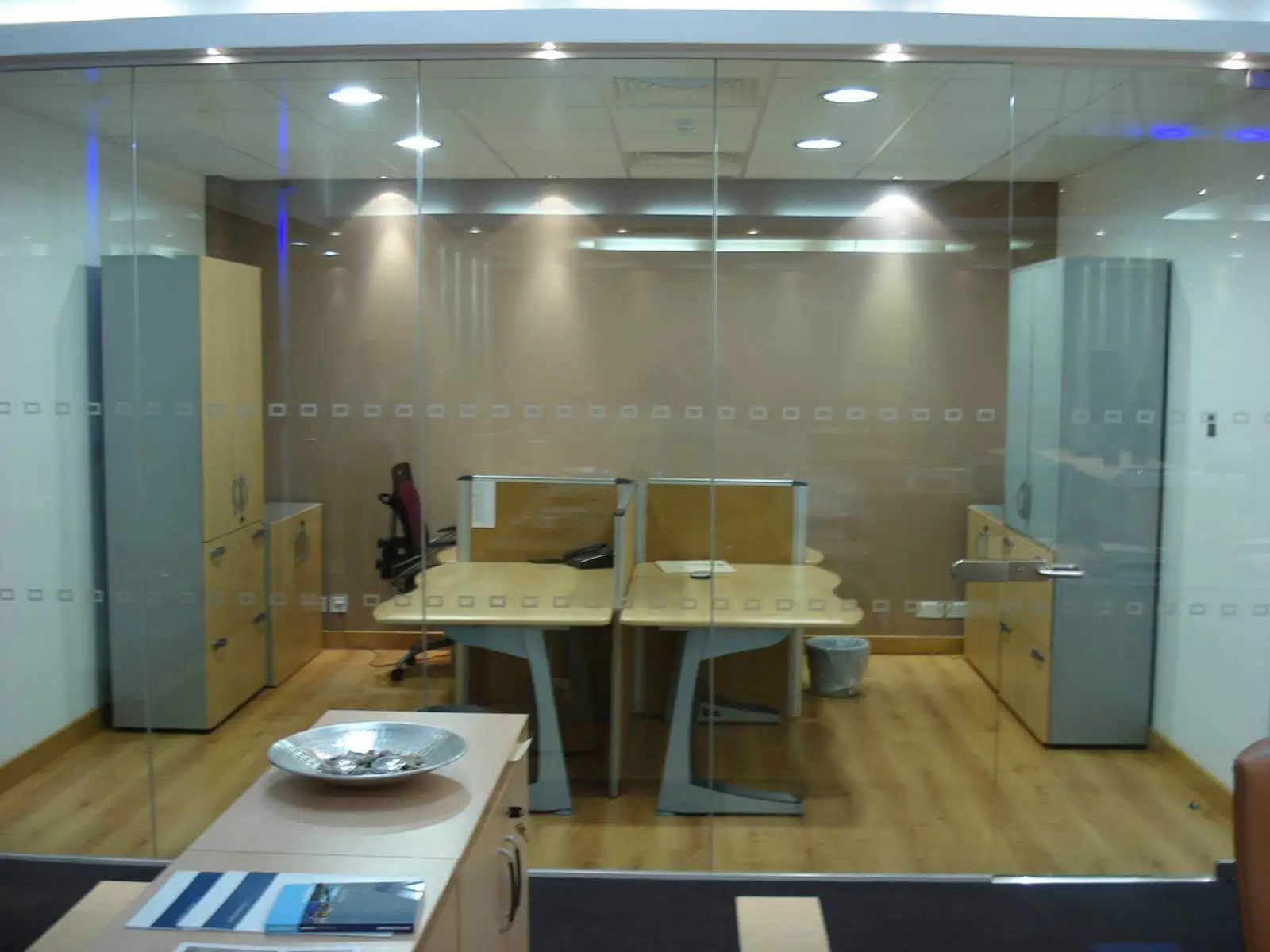 GXI office unit D space design with designer furniture, along with flooring, ceiling, and glass partitions 11