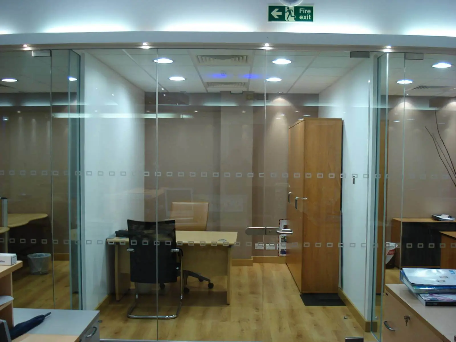 GXI office unit D space design with designer furniture, along with flooring, ceiling, and glass partitions 12