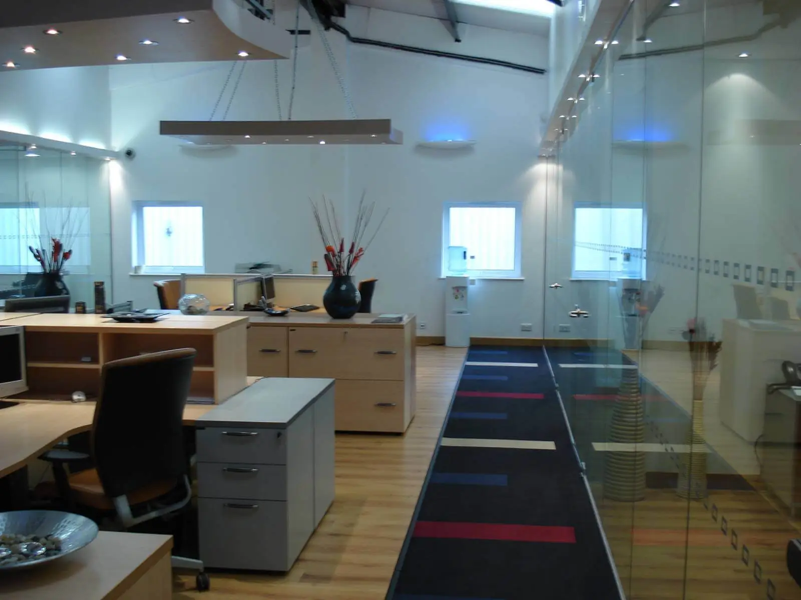 GXI office unit D space design with designer furniture, along with flooring, ceiling, and glass partitions 14