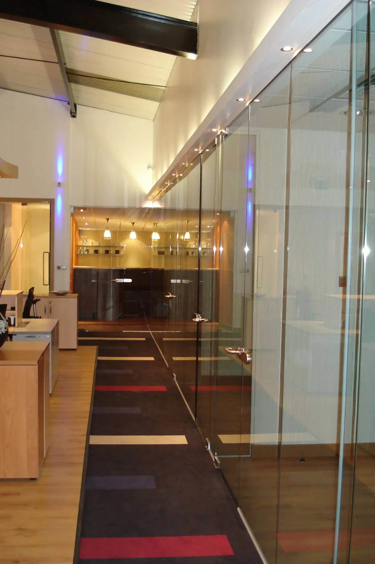GXI office unit D space design with designer furniture, along with flooring, ceiling, and glass partitions 8