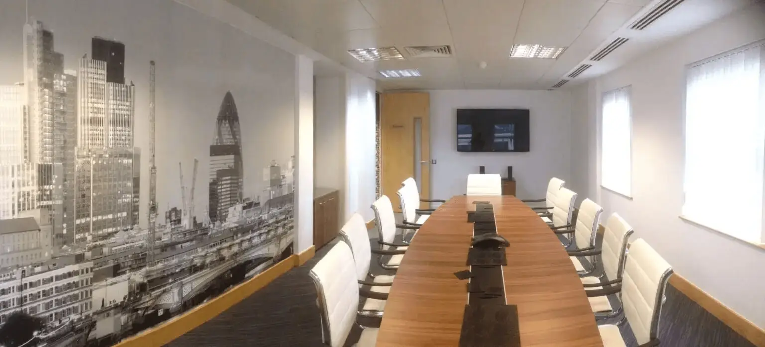 hcig office work space with designer furniture, glass partitions, suspended grid ceiling, and designer flooring 11