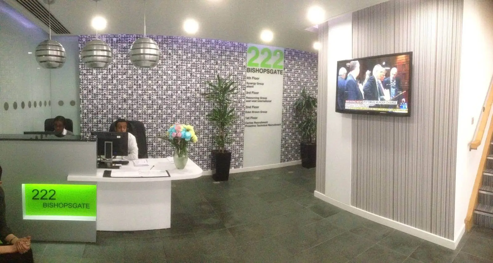 hcig office work space with designer furniture, glass partitions, suspended grid ceiling, and designer flooring 14