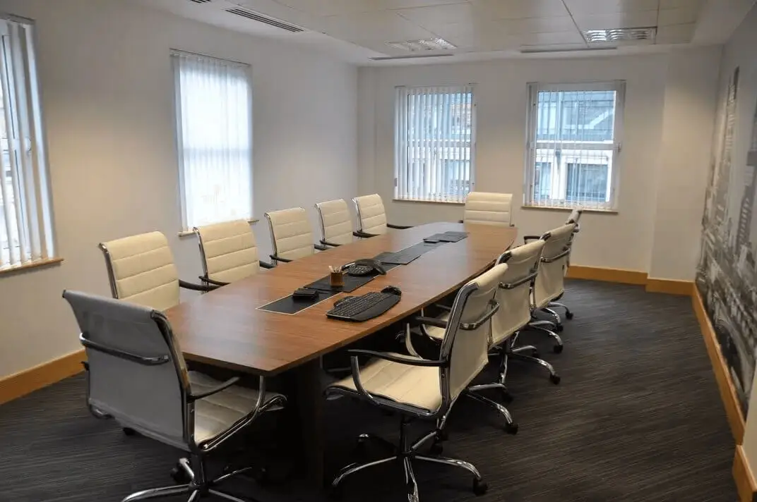 hcig office work space with designer furniture, glass partitions, suspended grid ceiling, and designer flooring 2