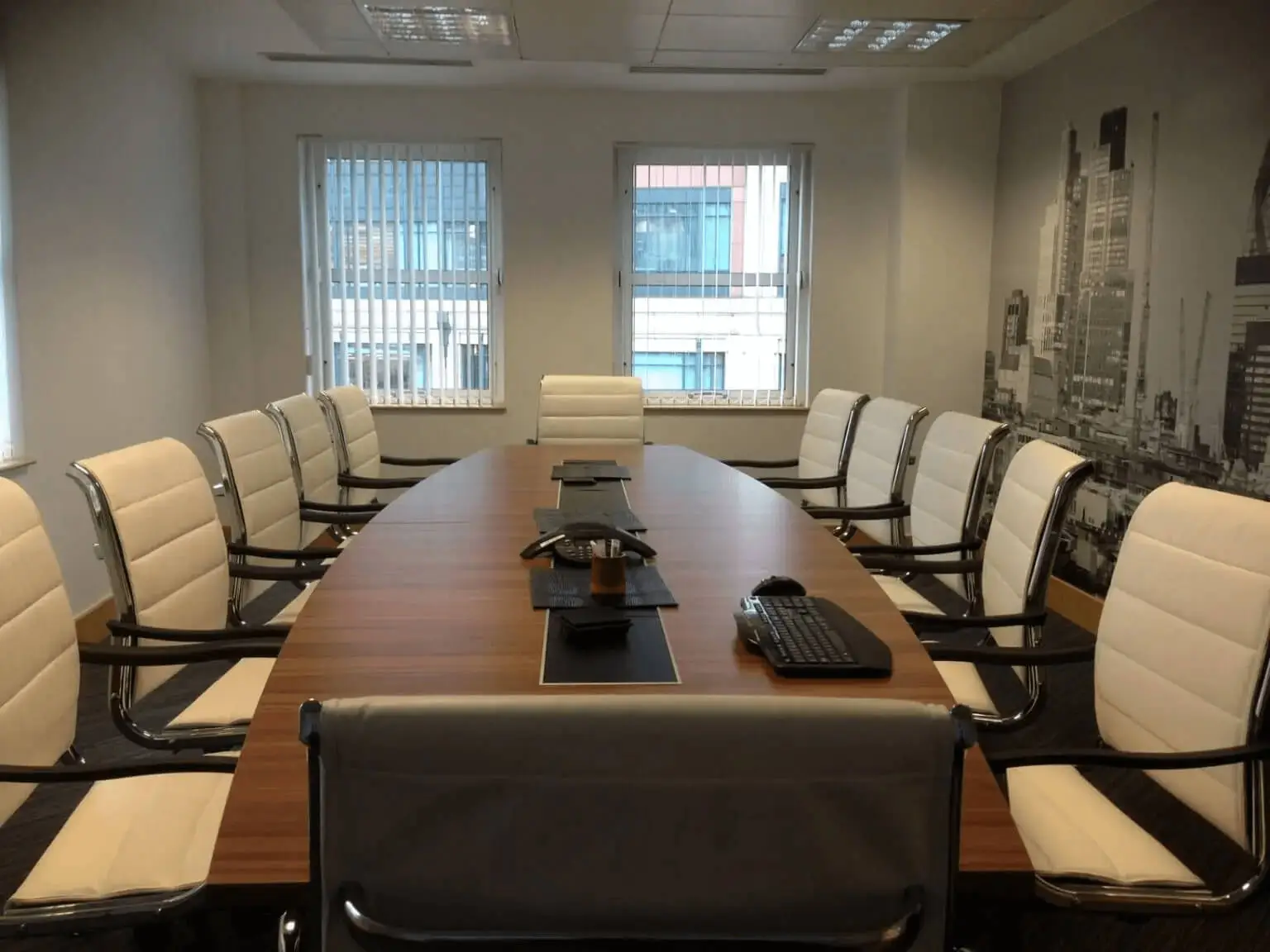 hcig office work space with designer furniture, glass partitions, suspended grid ceiling, and designer flooring 9