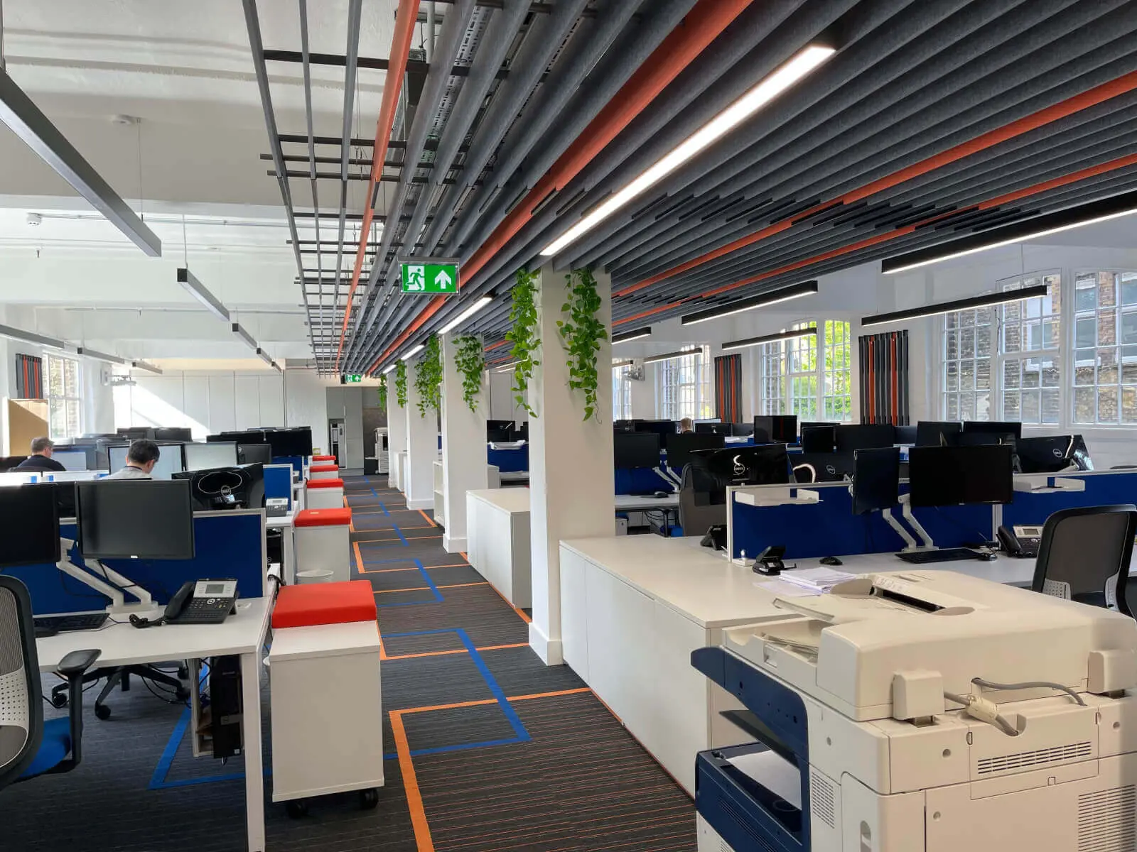 Mendik Waring office space design with designer flooring, acoustic ceiling and black framed glass partitions 21
