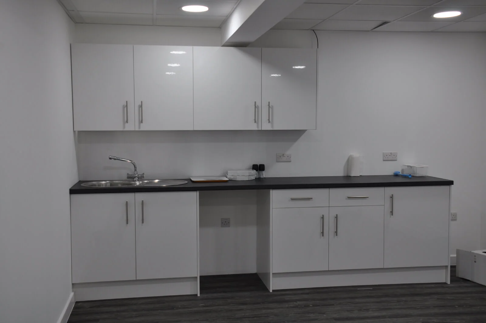 Nasco office space with designer flooring and single glazed solid stud wall glass partitions 16