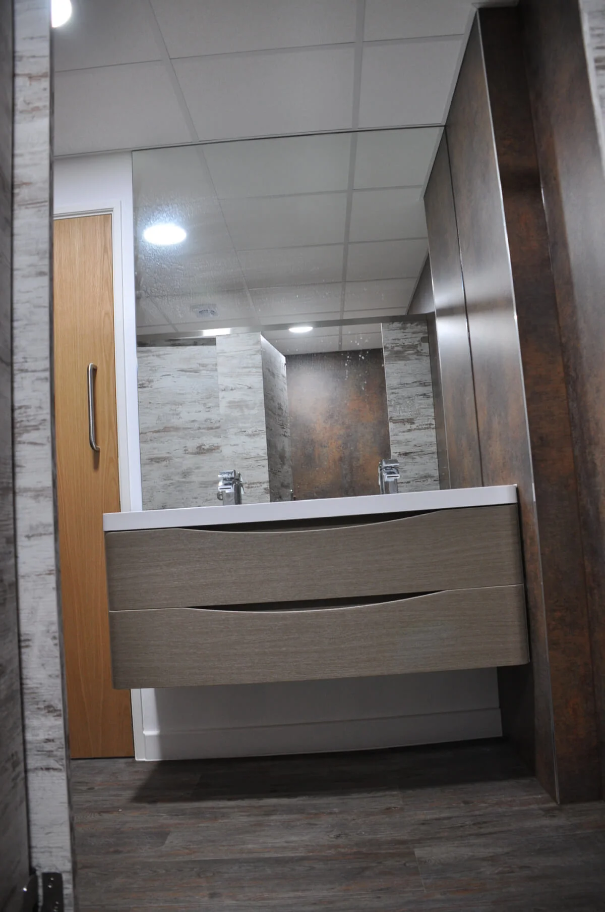 Nasco office space with designer flooring and single glazed solid stud wall glass partitions 23