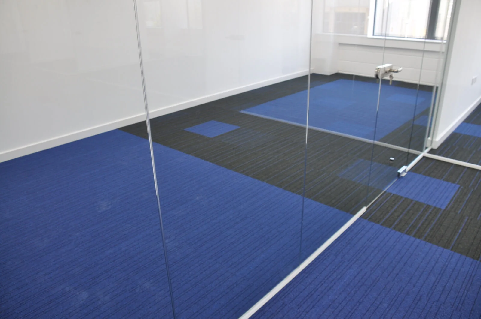 Nasco office space with designer flooring and single glazed solid stud wall glass partitions 3