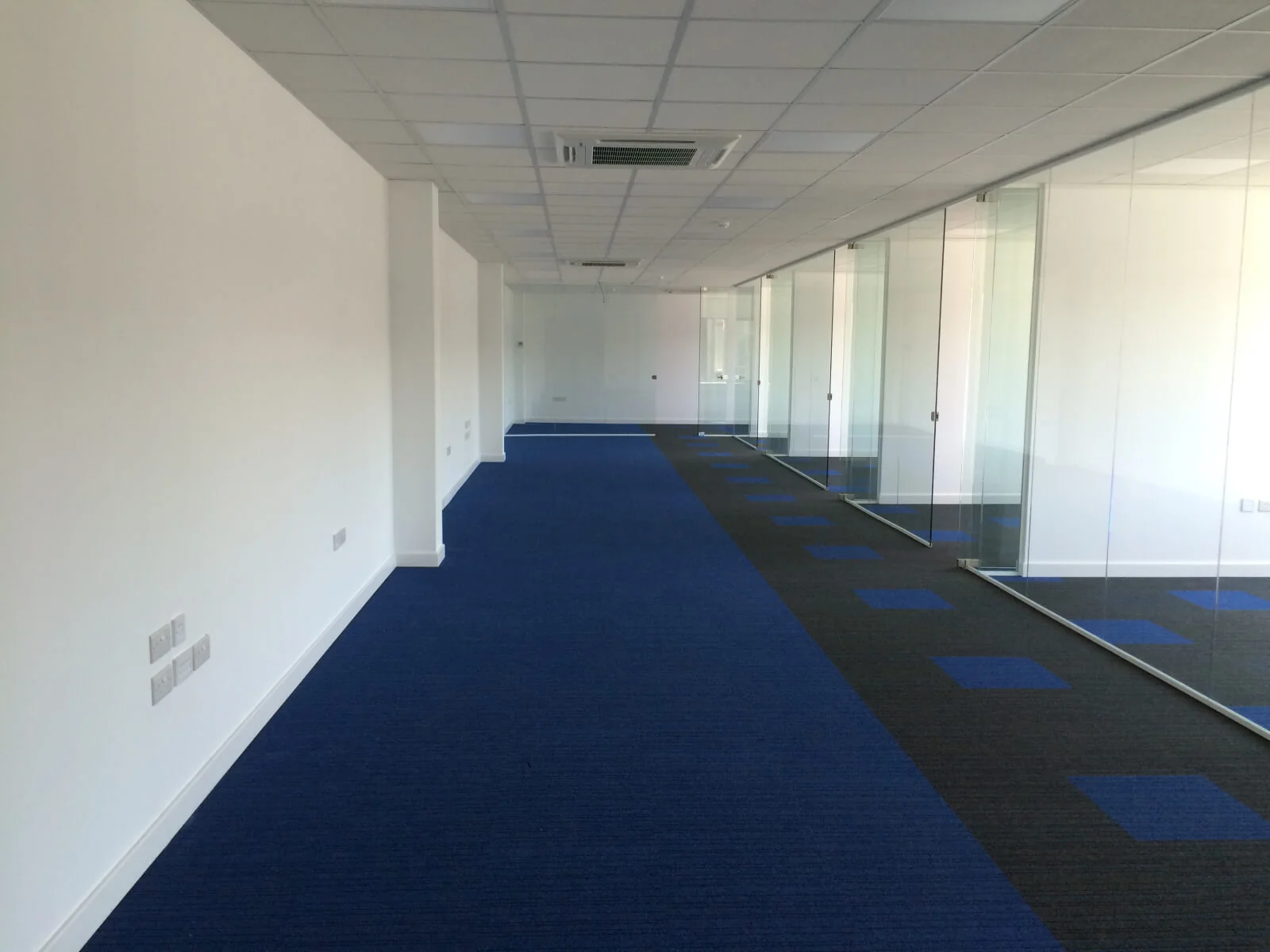 Nasco office space with designer flooring and single glazed solid stud wall glass partitions 39