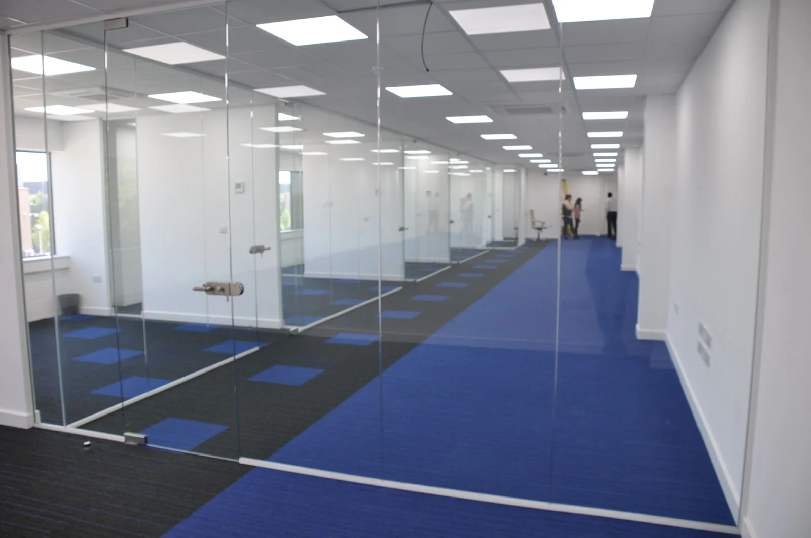 Nasco office space with designer flooring and single glazed solid stud wall glass partitions 5