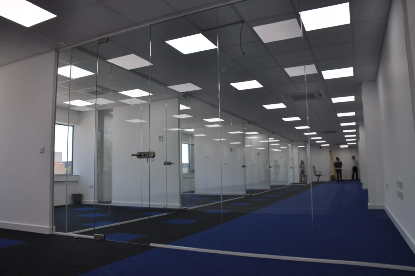 Nasco office space with designer flooring and single glazed solid stud wall glass partitions 6