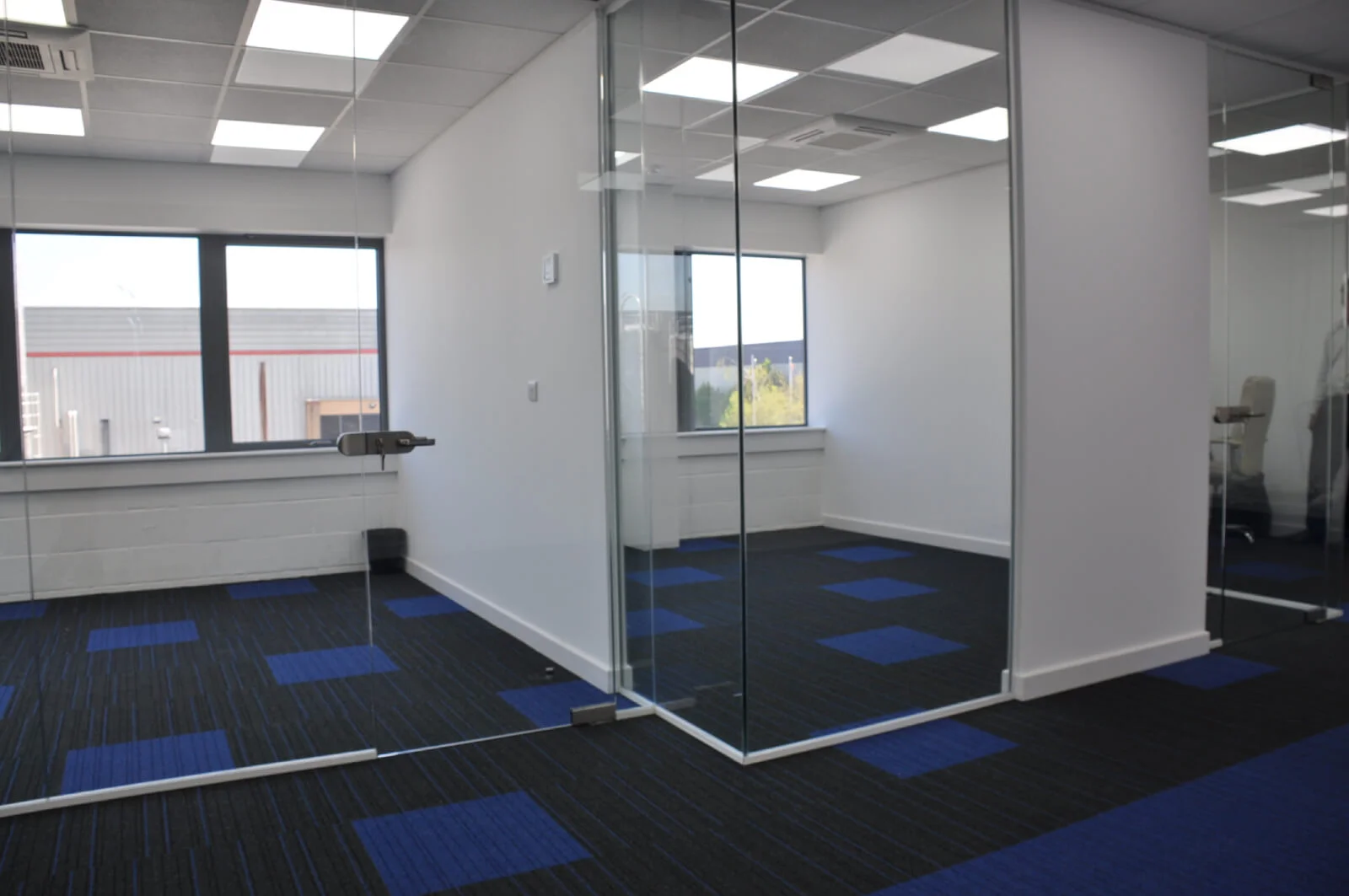 Nasco office space with designer flooring and single glazed solid stud wall glass partitions 9