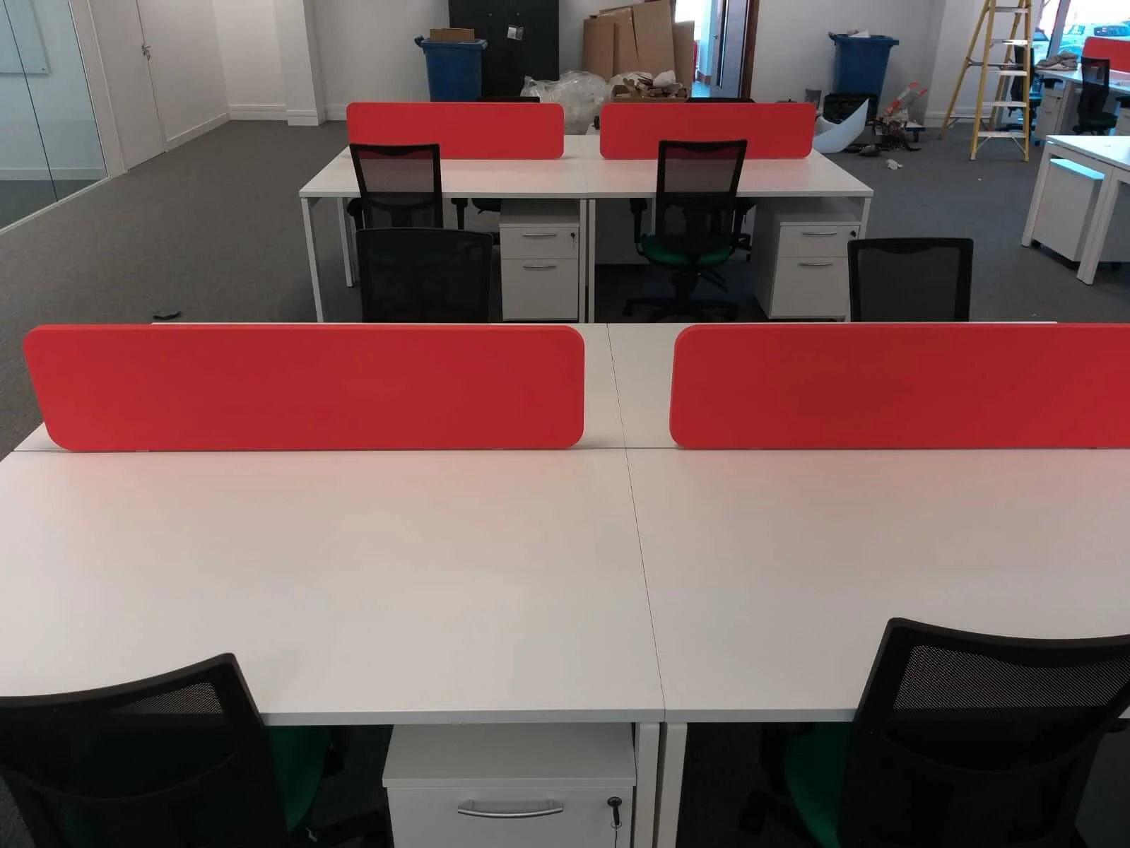 Oppo office space with designer single and back to back desks chairs and glass partitions 10