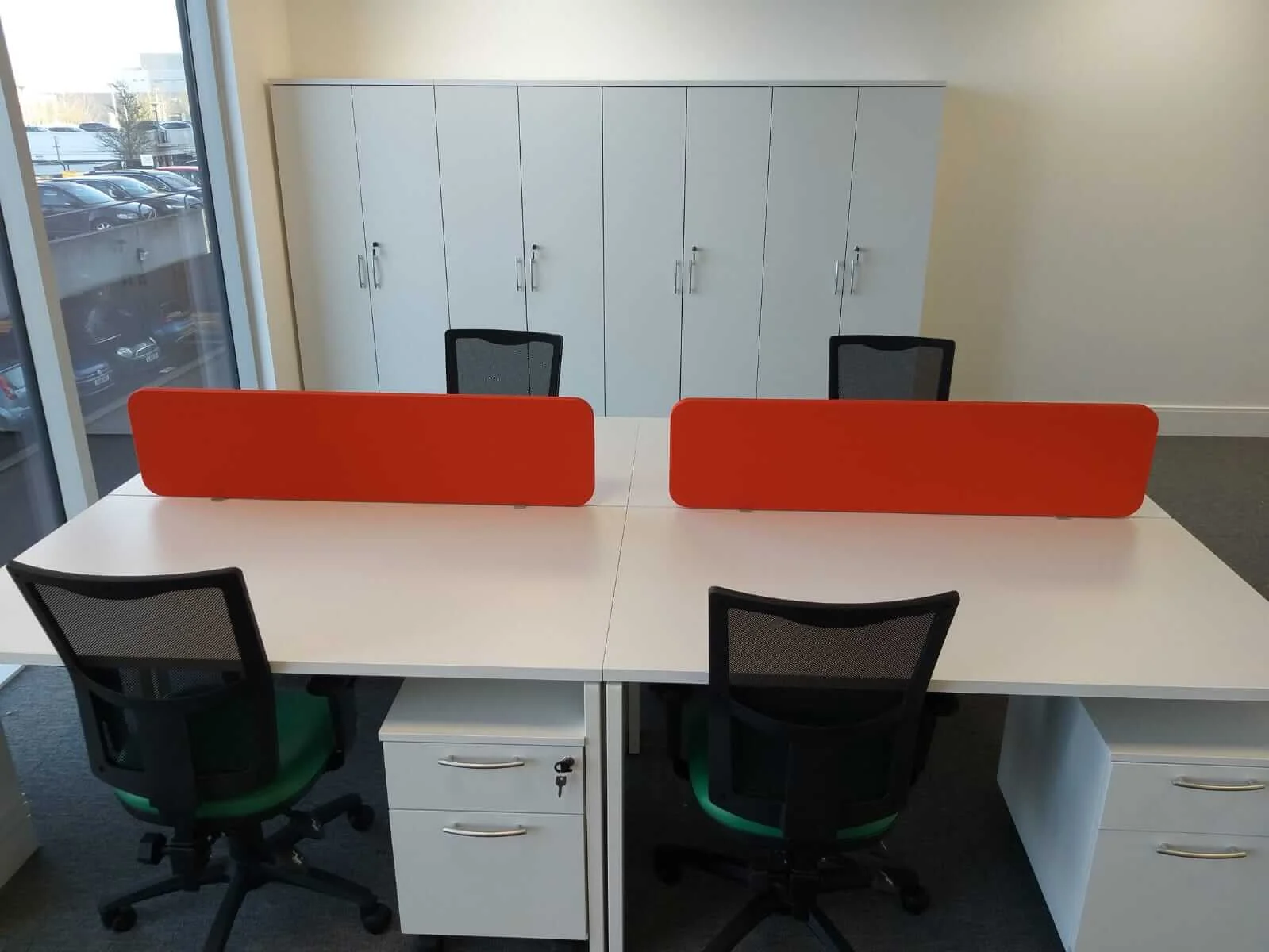 Oppo office space with designer single and back to back desks chairs and glass partitions 11