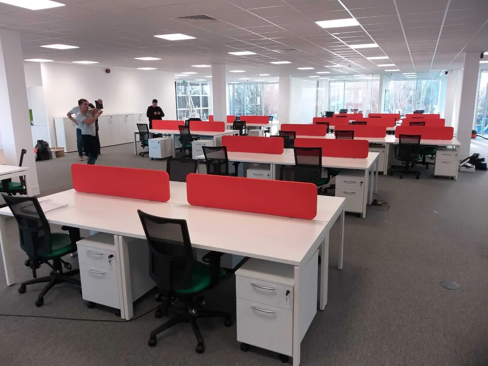 Oppo office space with designer single and back to back desks chairs and glass partitions 13
