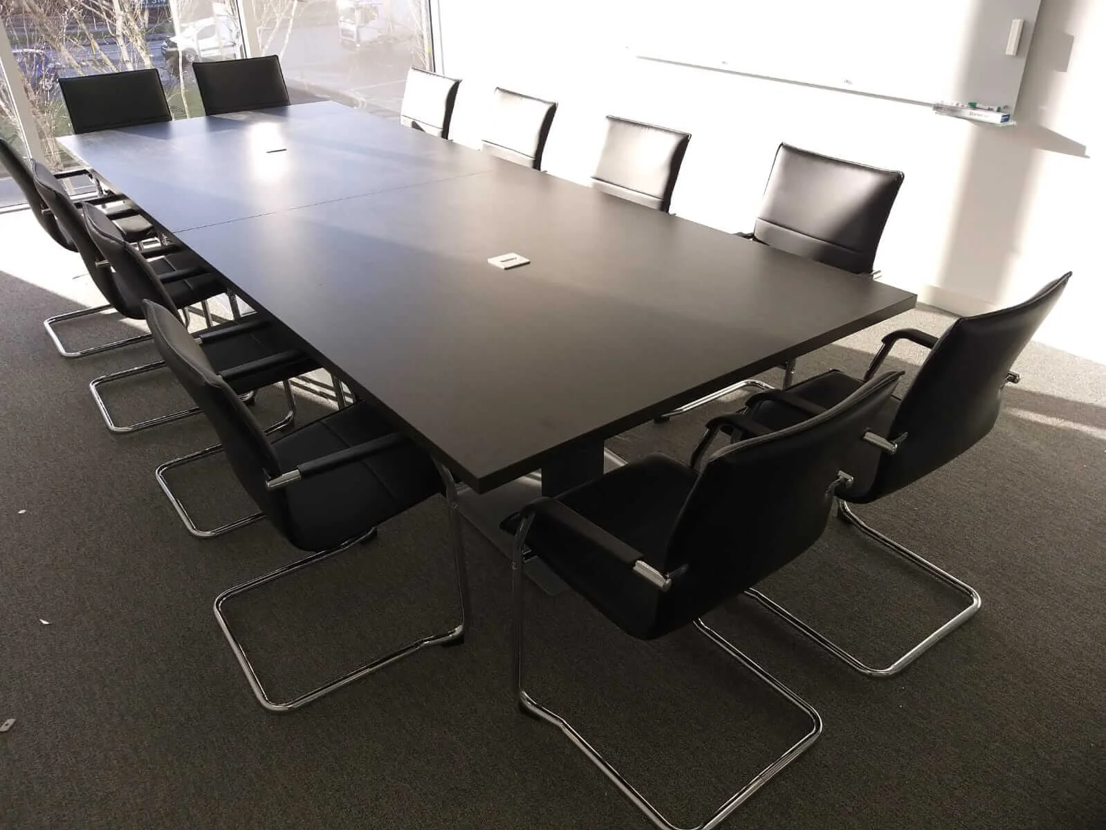 Oppo office space with designer single and back to back desks chairs and glass partitions 15