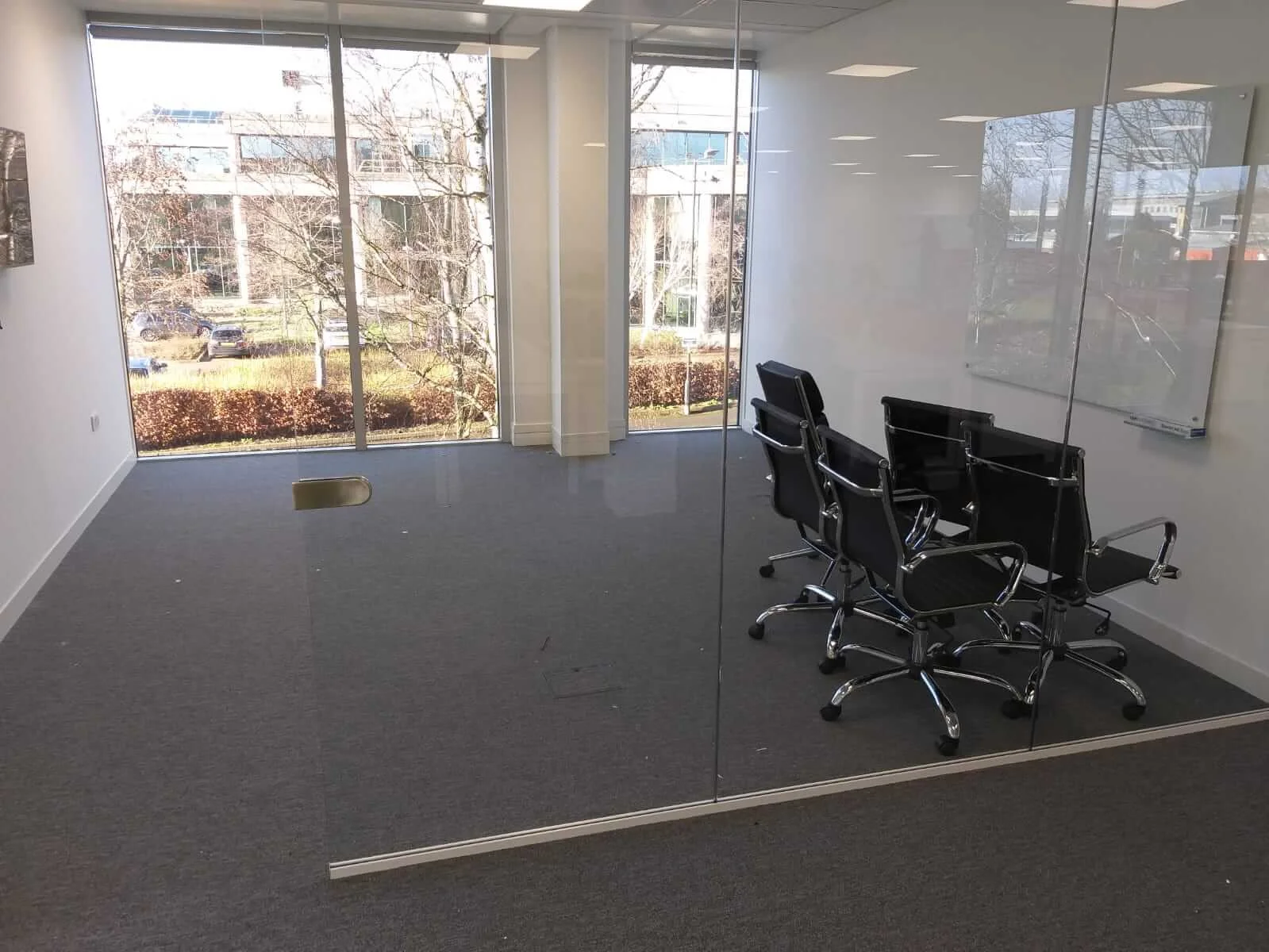Oppo office space with designer single and back to back desks chairs and glass partitions 17