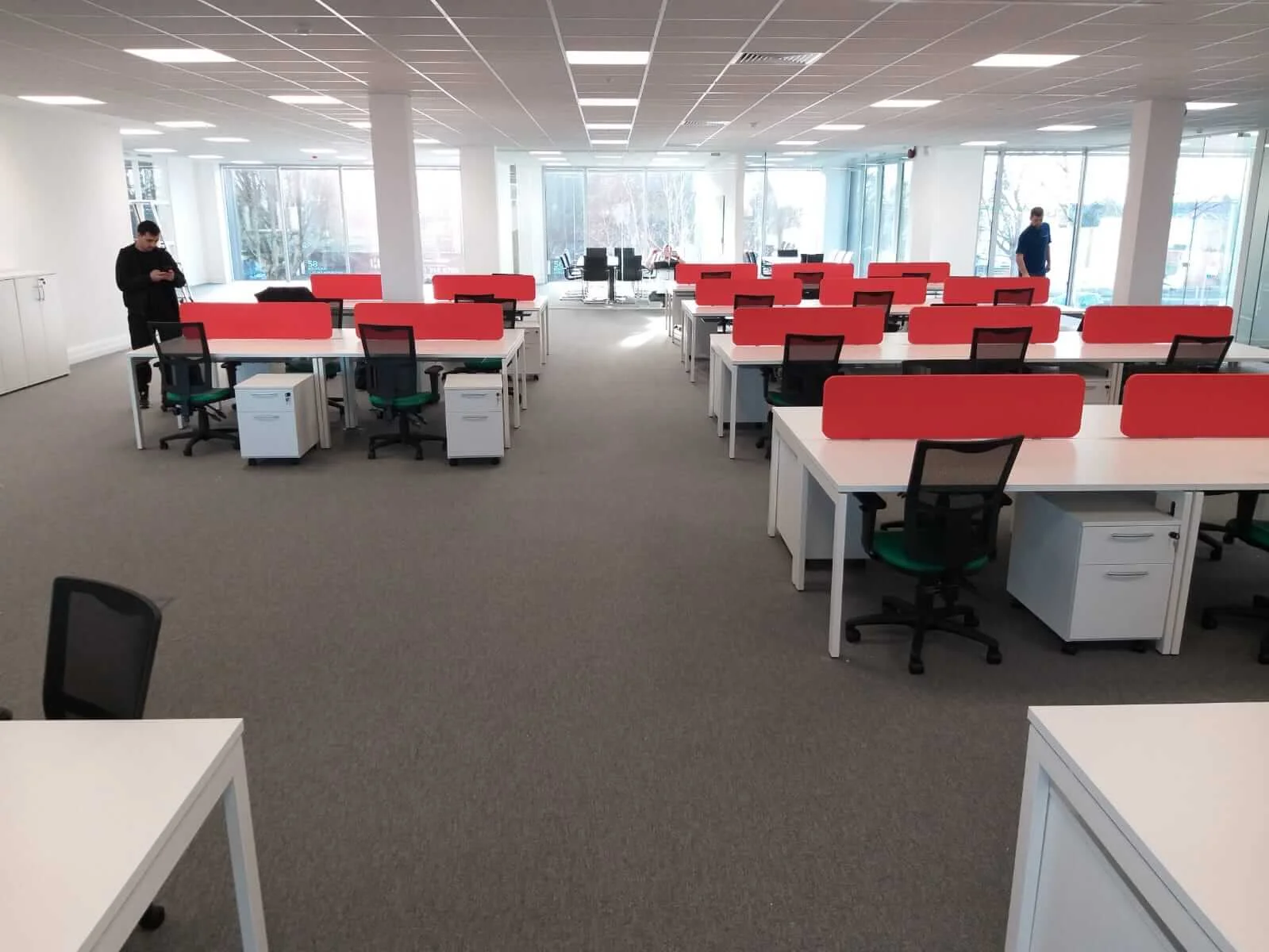 Oppo office space with designer single and back to back desks chairs and glass partitions 19