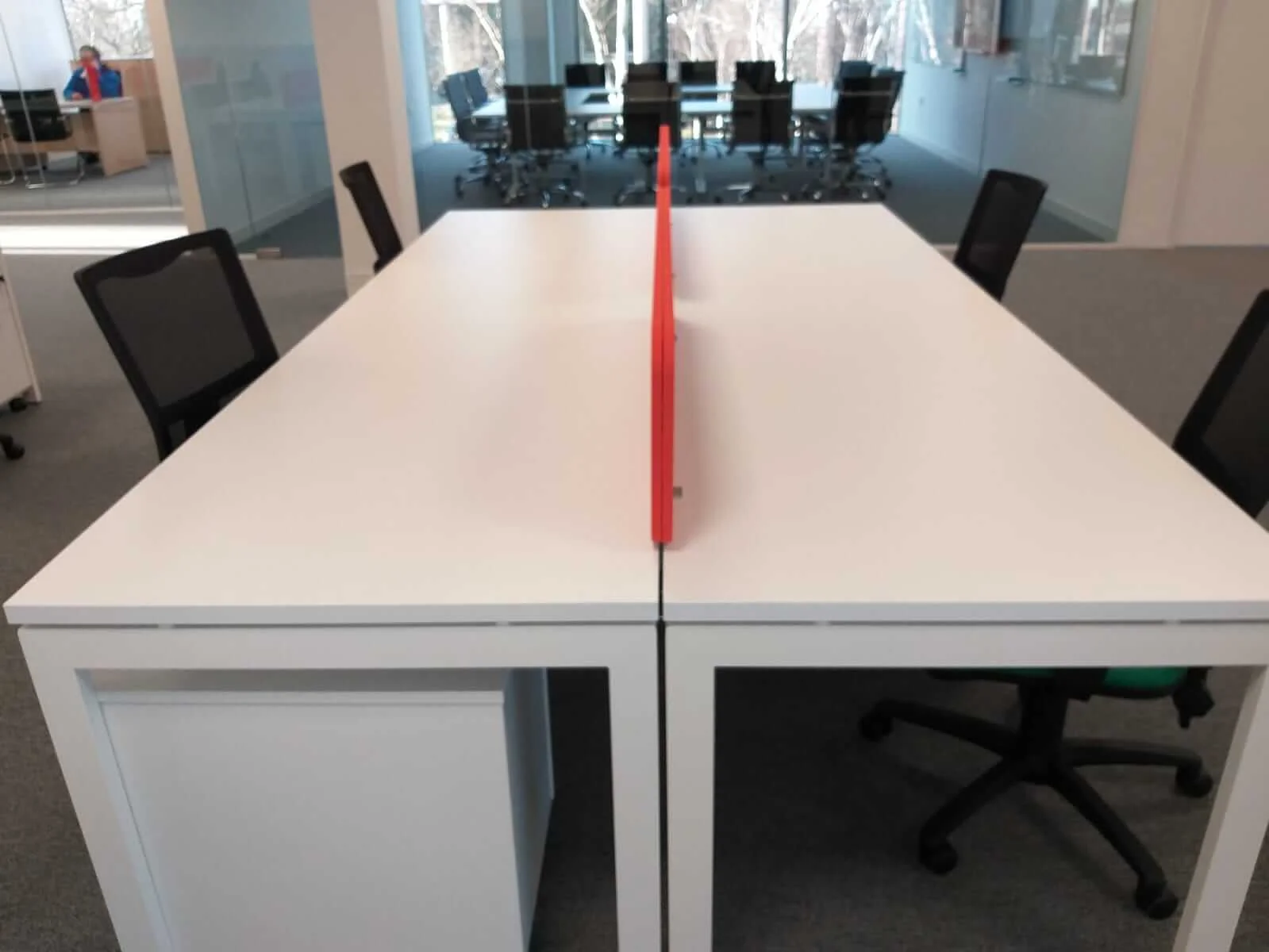 Oppo office space with designer single and back to back desks chairs and glass partitions 2