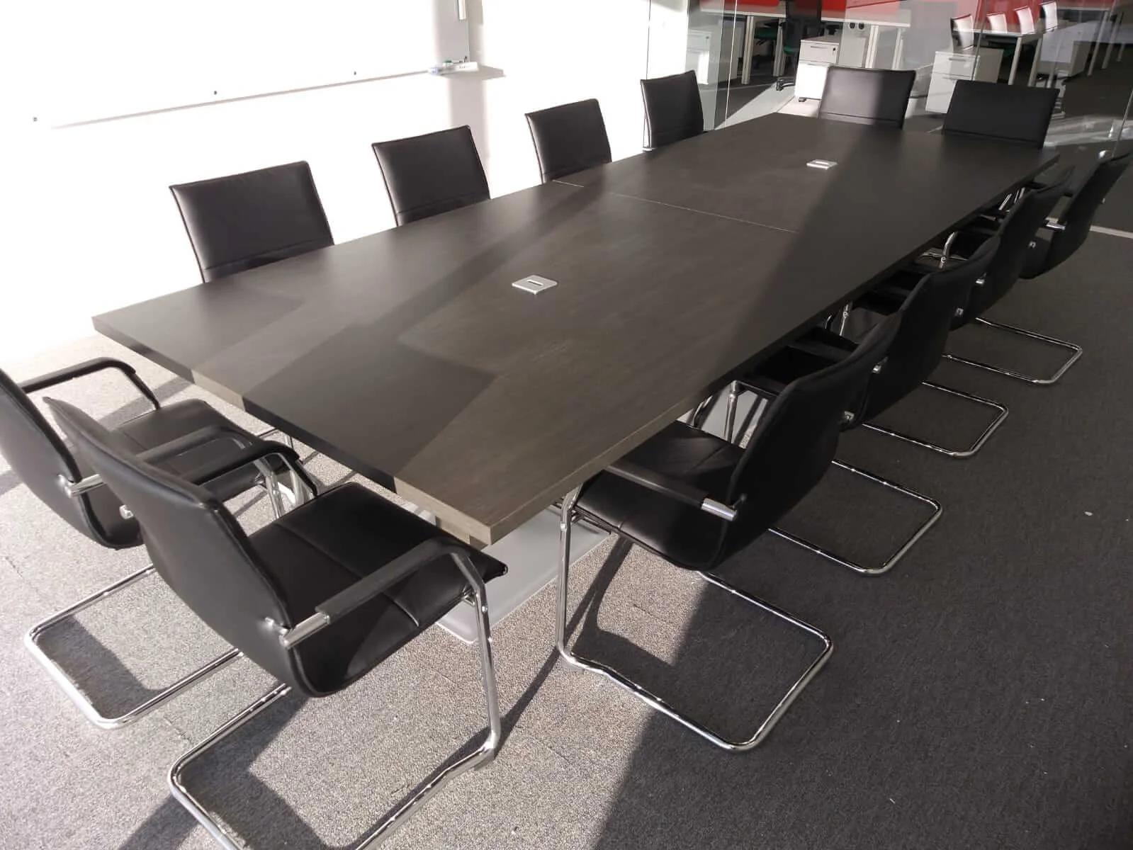 Oppo office space with designer single and back to back desks chairs and glass partitions 3