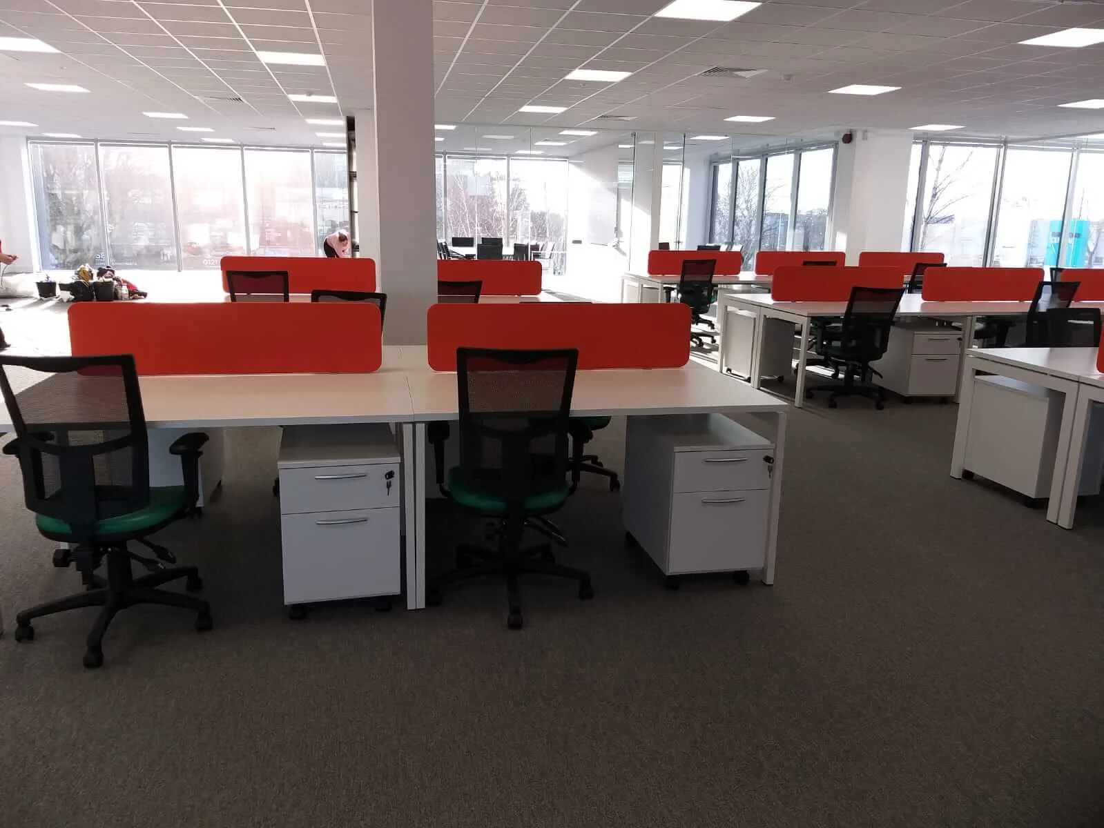Oppo office space with designer single and back to back desks chairs and glass partitions 4