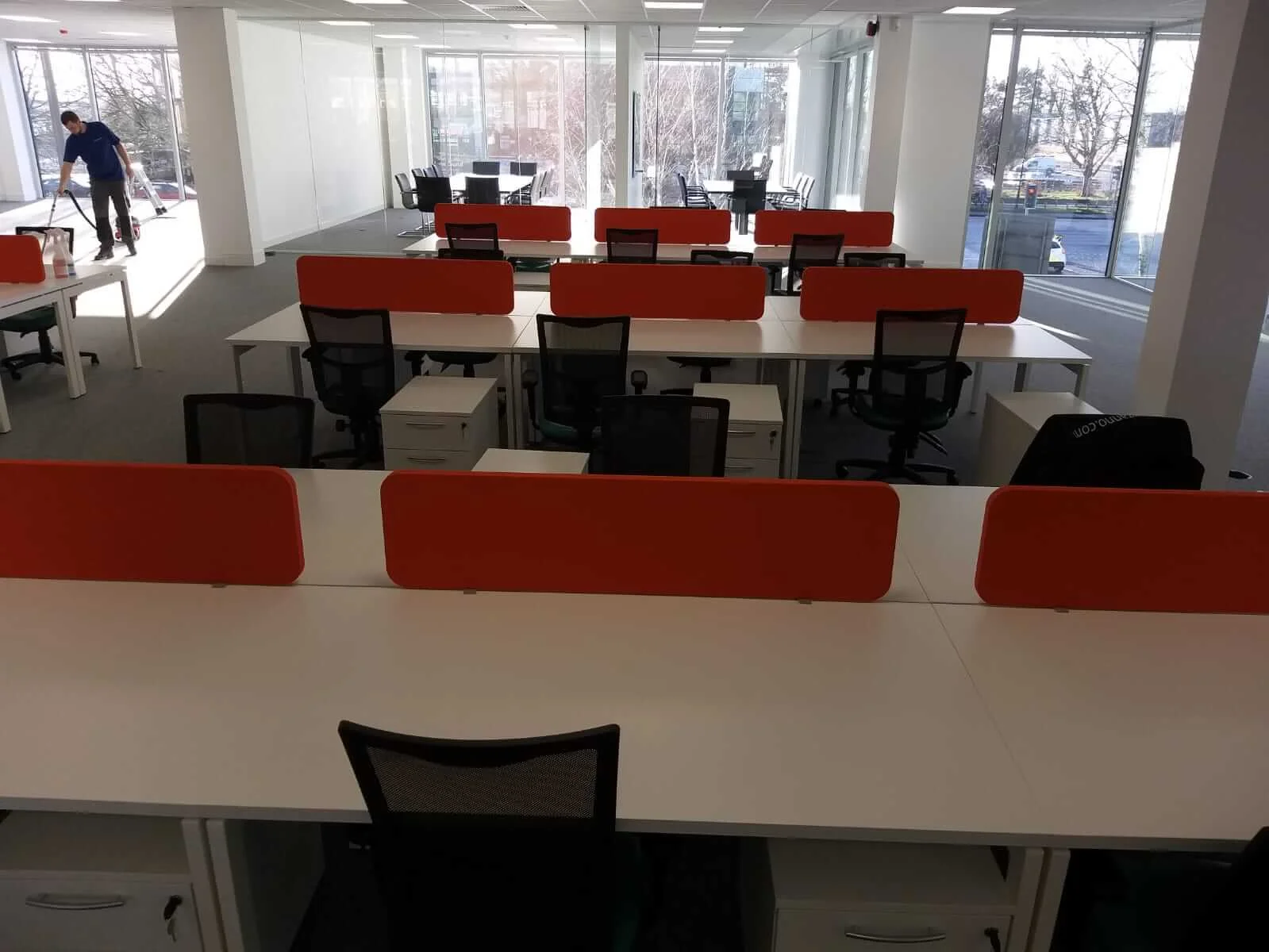 Oppo office space with designer single and back to back desks chairs and glass partitions 6