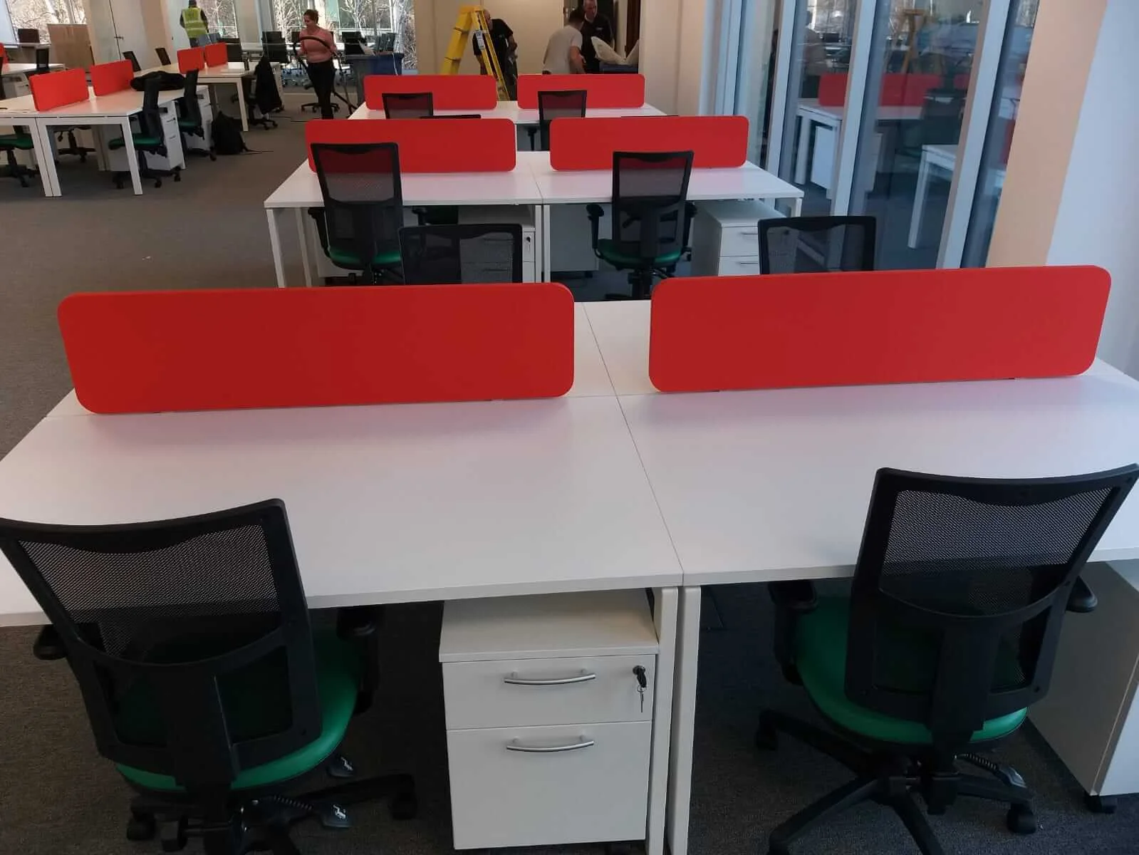 Oppo office space with designer single and back to back desks chairs and glass partitions 9