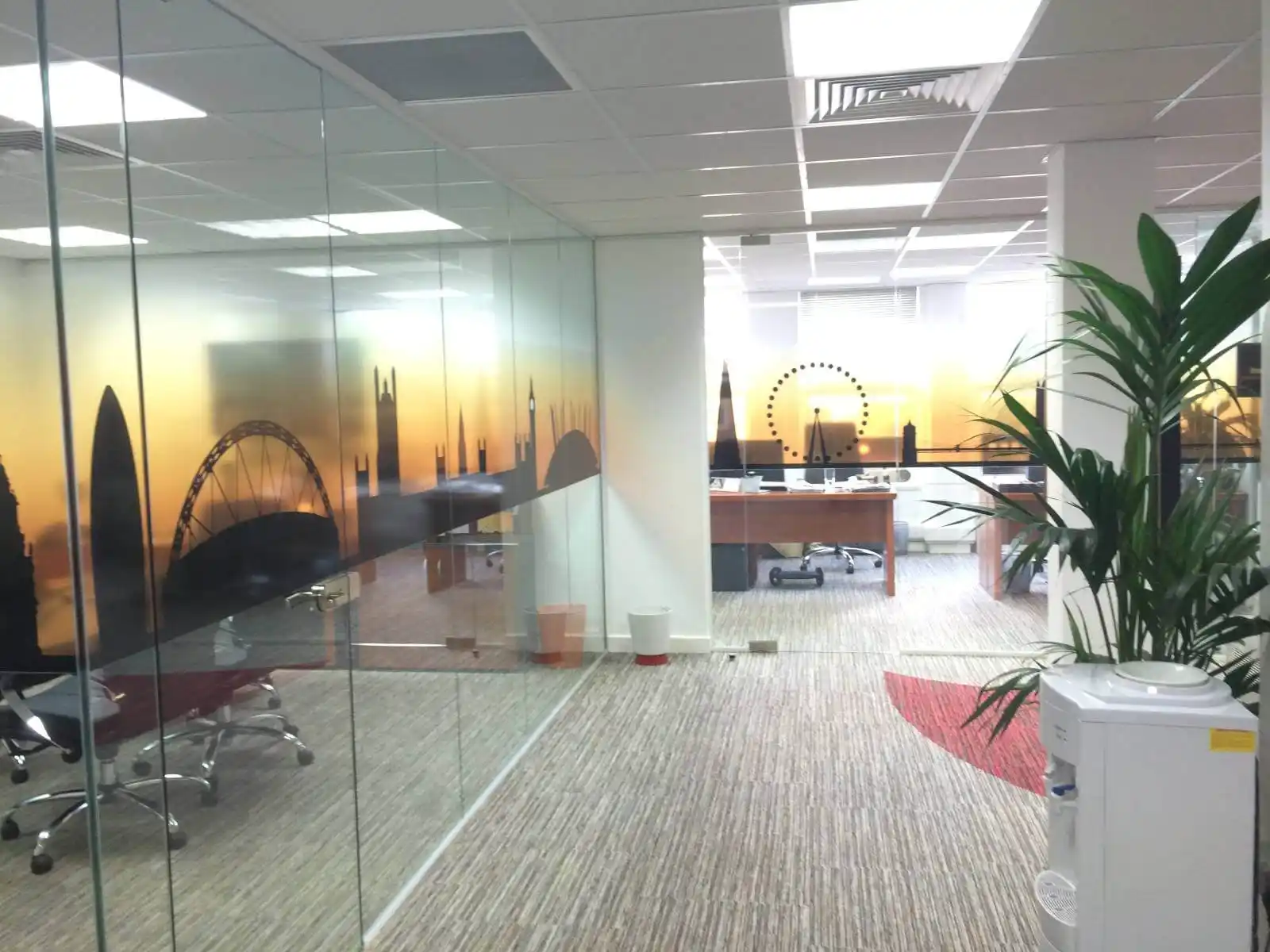 Prideview developers office space with designer furnitures and carpet tile flooring and suspended grid ceiling and frameless glass partitions screen 10