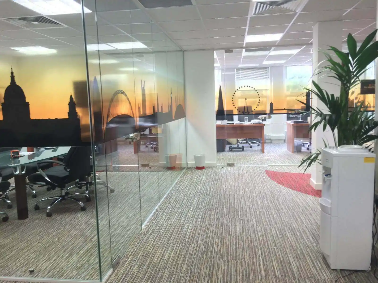 Prideview developers office space with designer furnitures and carpet tile flooring and suspended grid ceiling and frameless glass partitions screen 11