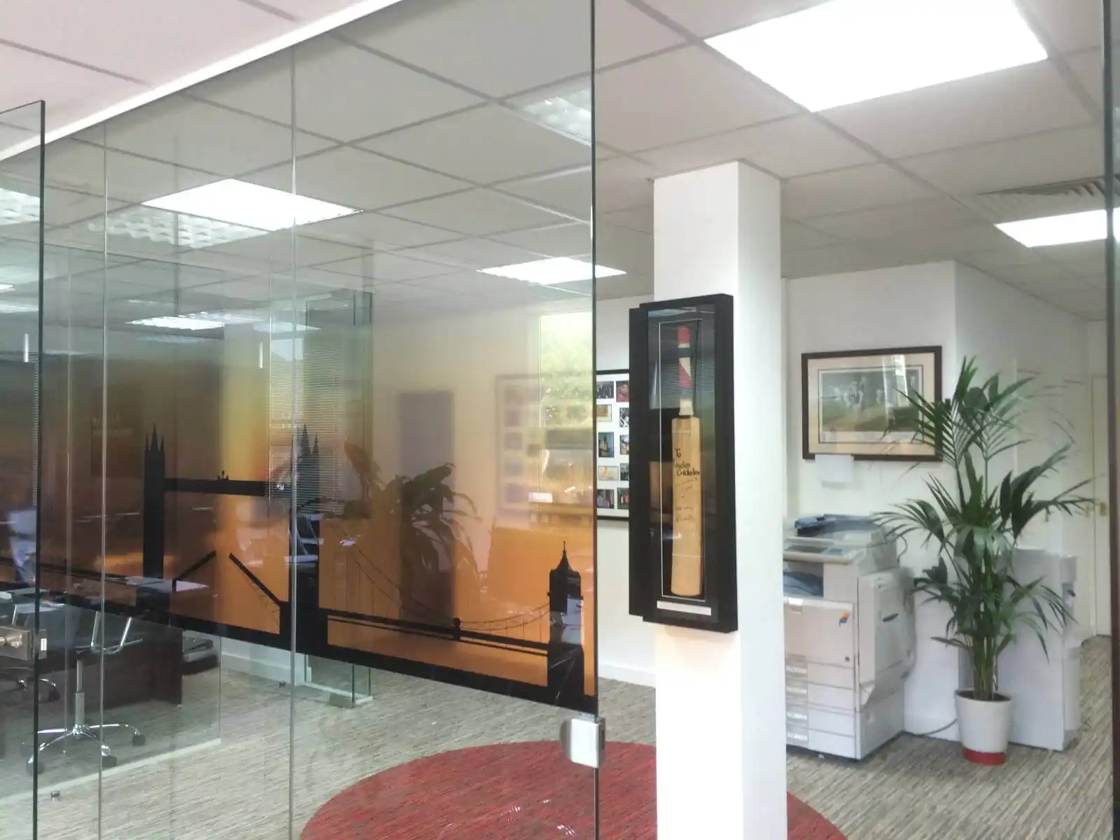 Prideview developers office space with designer furnitures and carpet tile flooring and suspended grid ceiling and frameless glass partitions screen 15