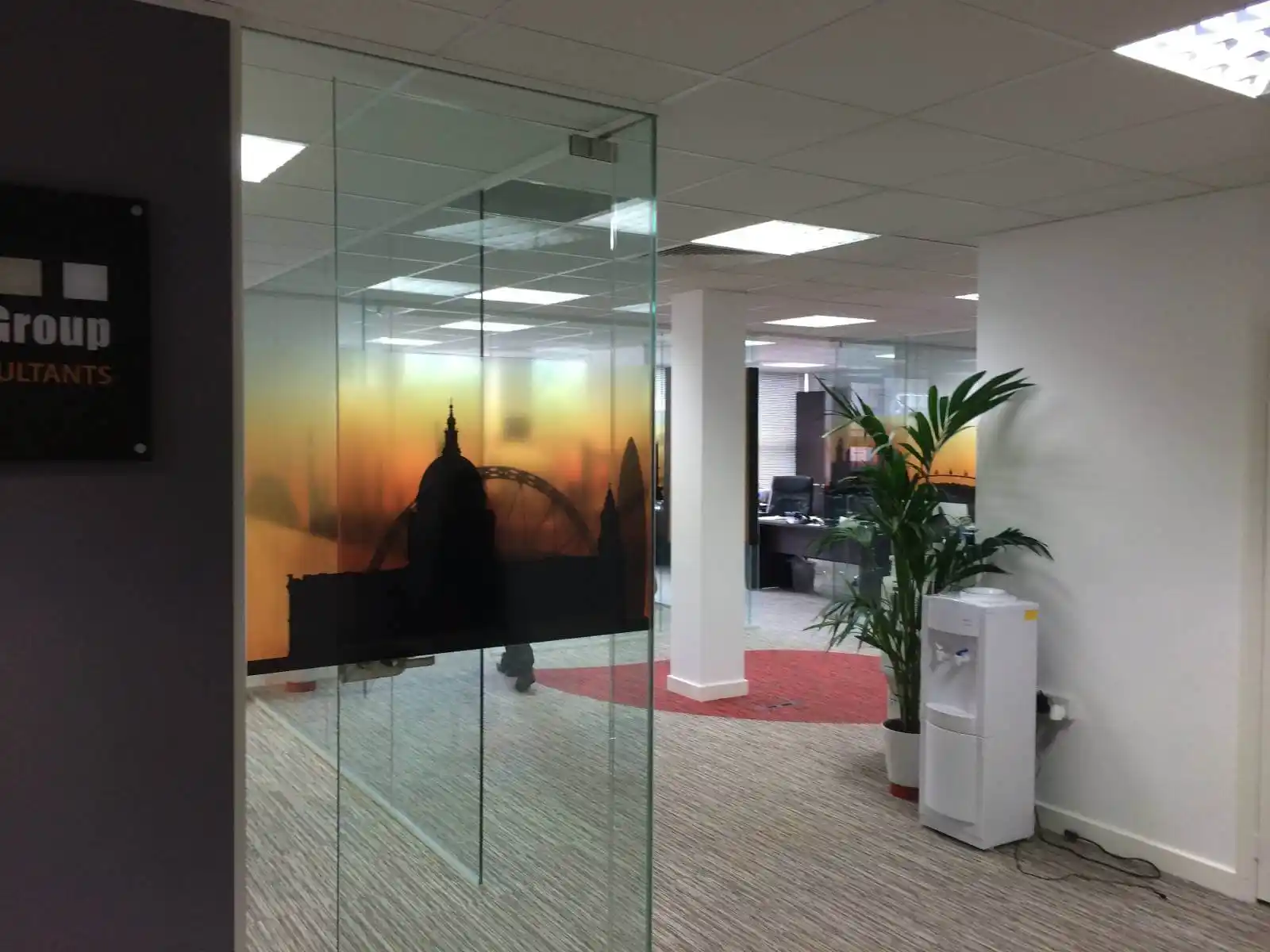 Prideview developers office space with designer furnitures and carpet tile flooring and suspended grid ceiling and frameless glass partitions screen 2