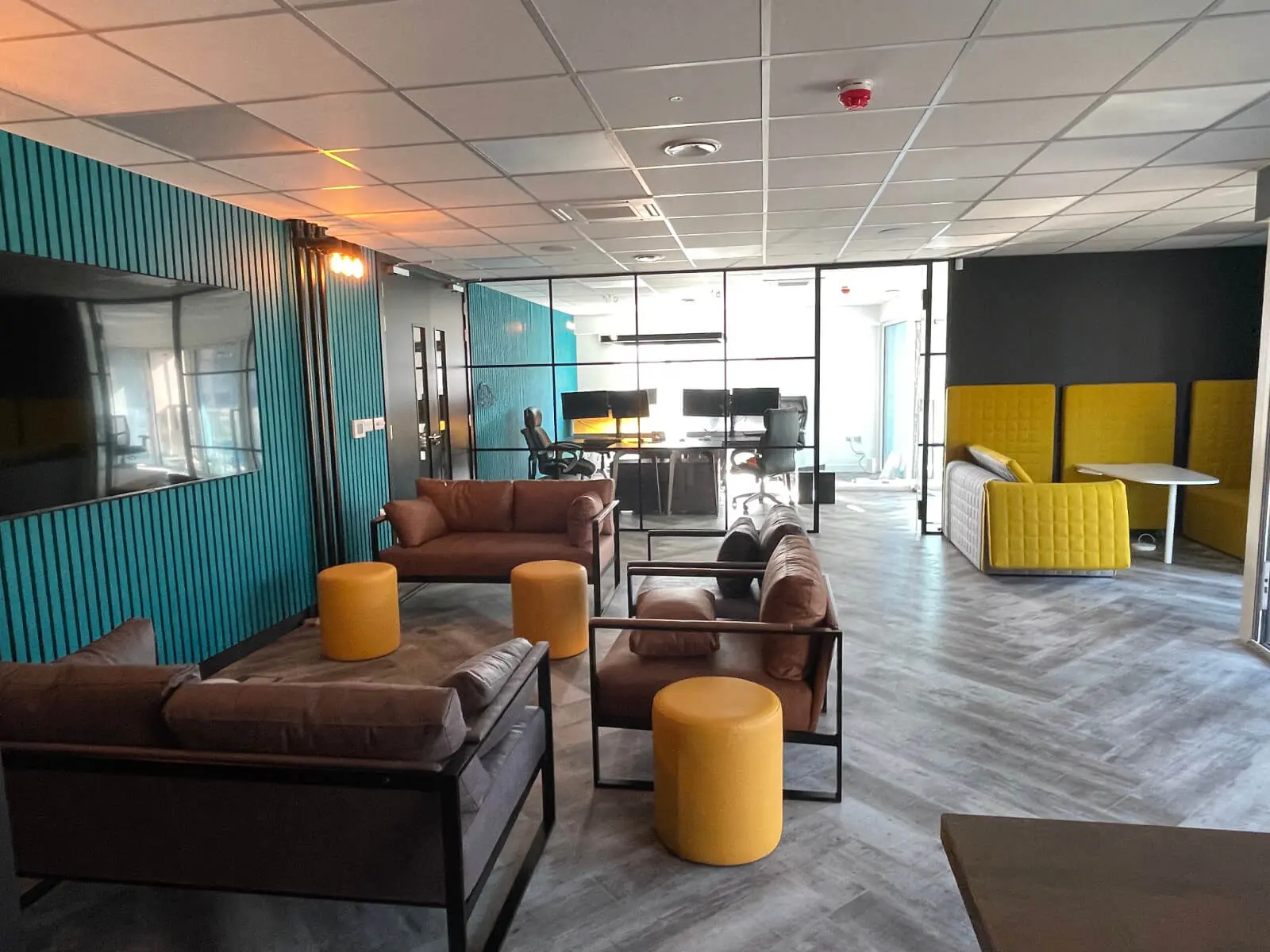 Prideview Properties office space with designer furnitures and black framed glass partitions 28