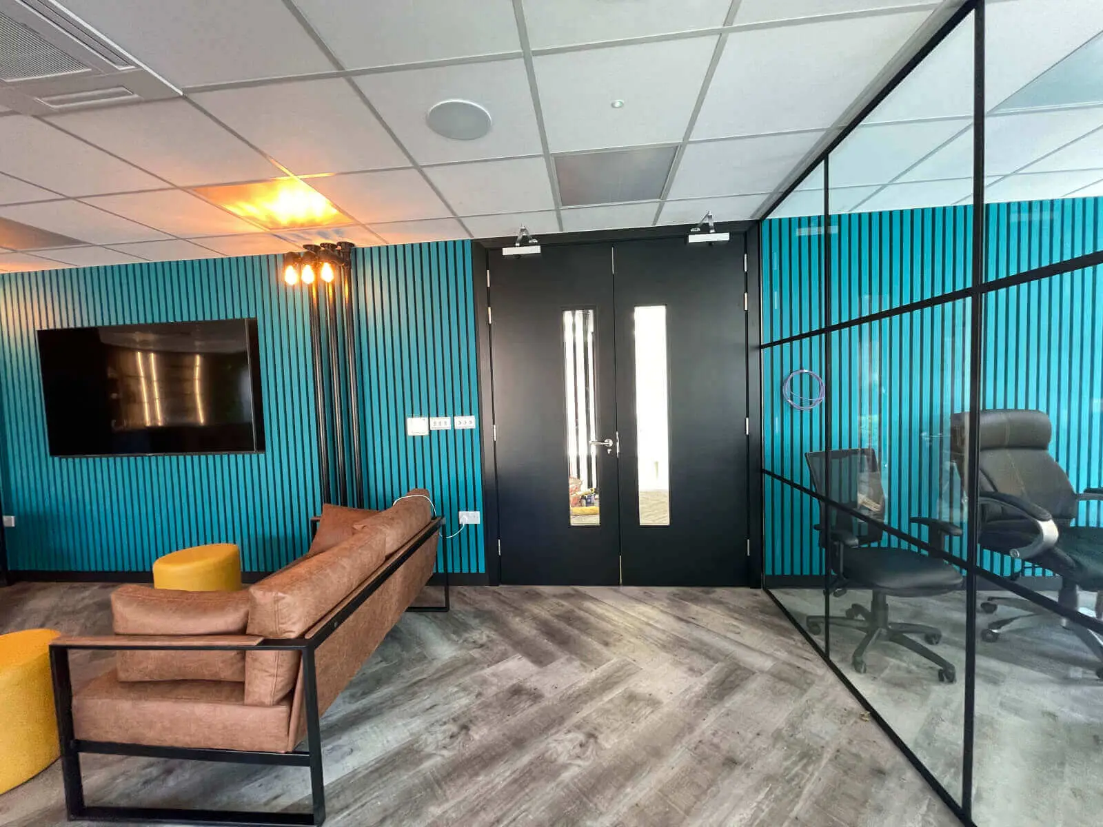 Prideview Properties office space with designer furnitures and black framed glass partitions 30