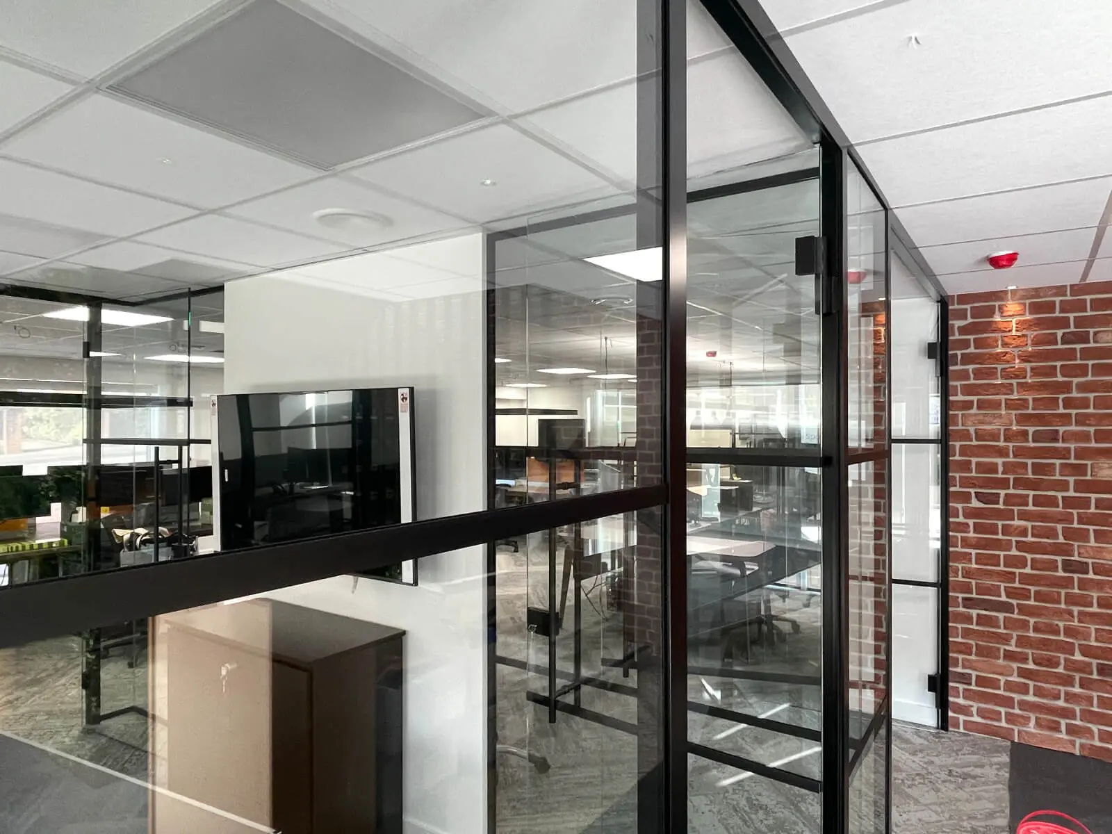 Prideview Properties office space with designer furnitures and black framed glass partitions 34