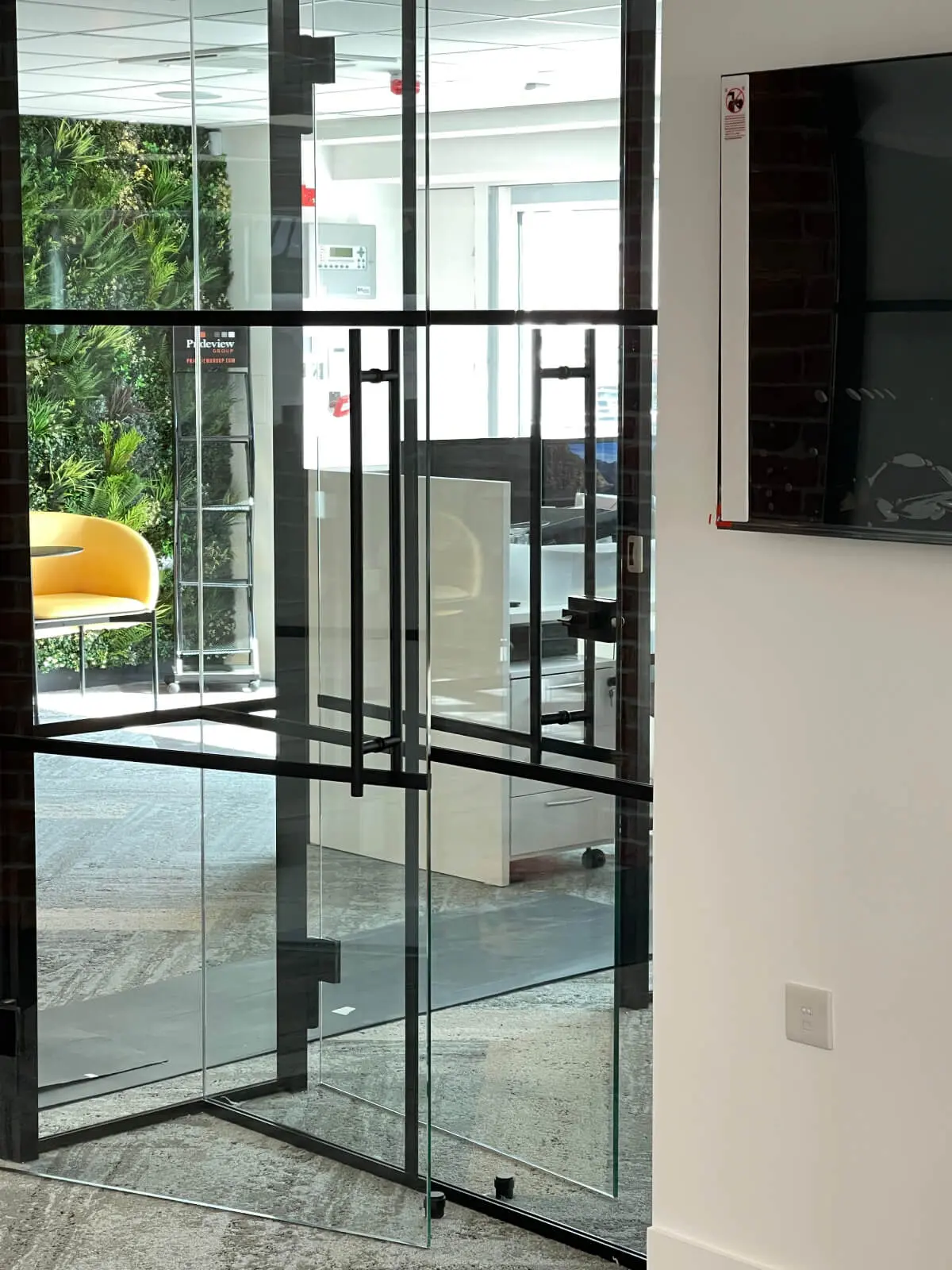 Prideview Properties office space with designer furnitures and black framed glass partitions 45