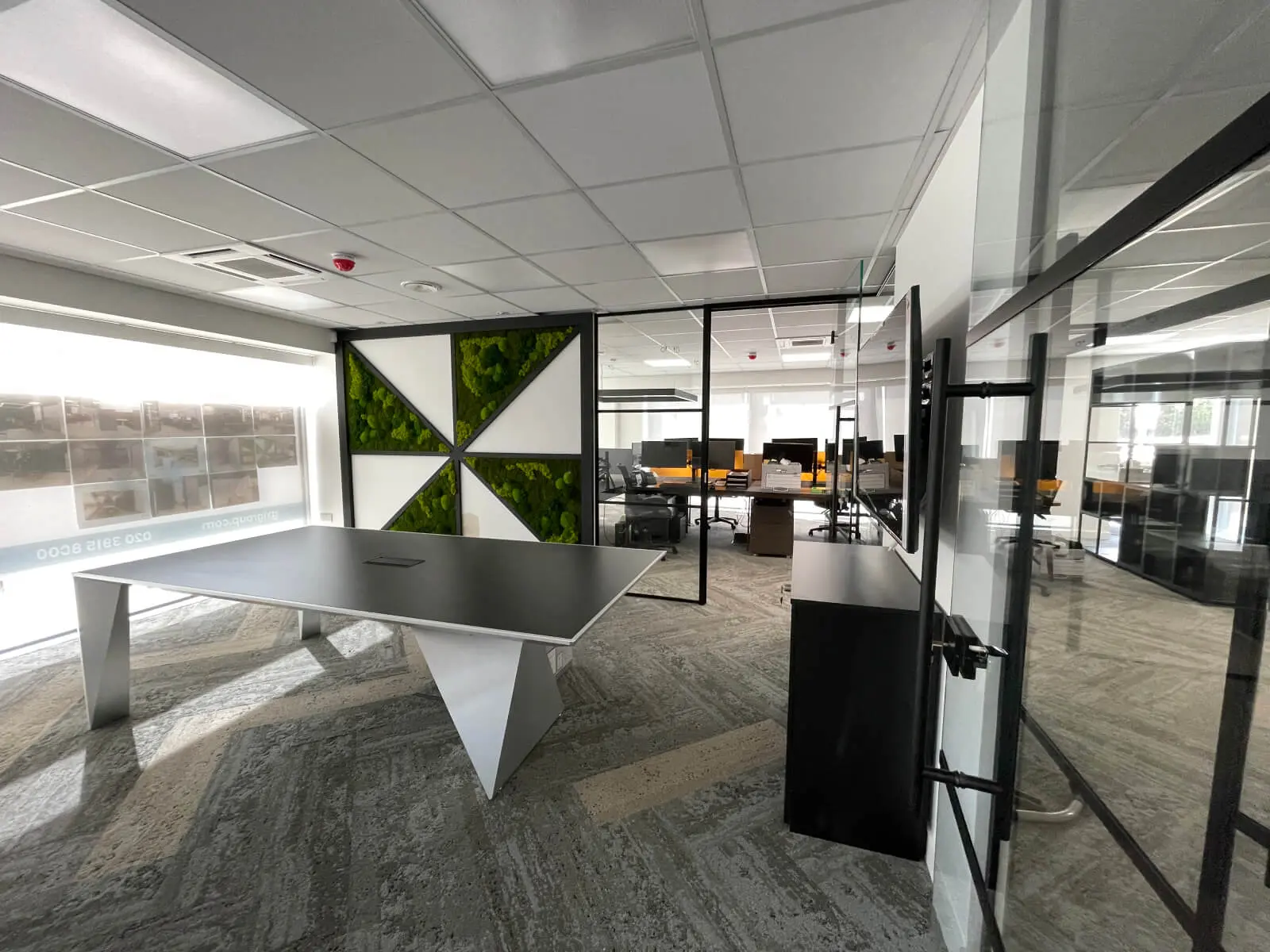 Prideview Properties office space with designer furnitures and black framed glass partitions 48