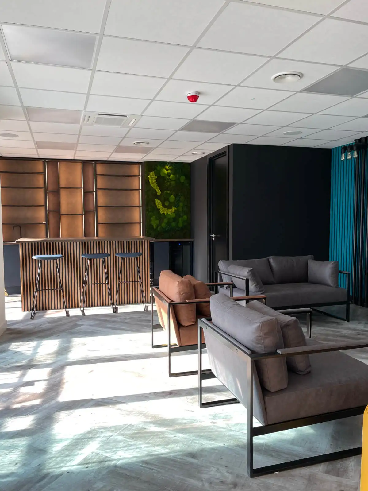 Prideview Properties office space with designer furnitures and black framed glass partitions 49