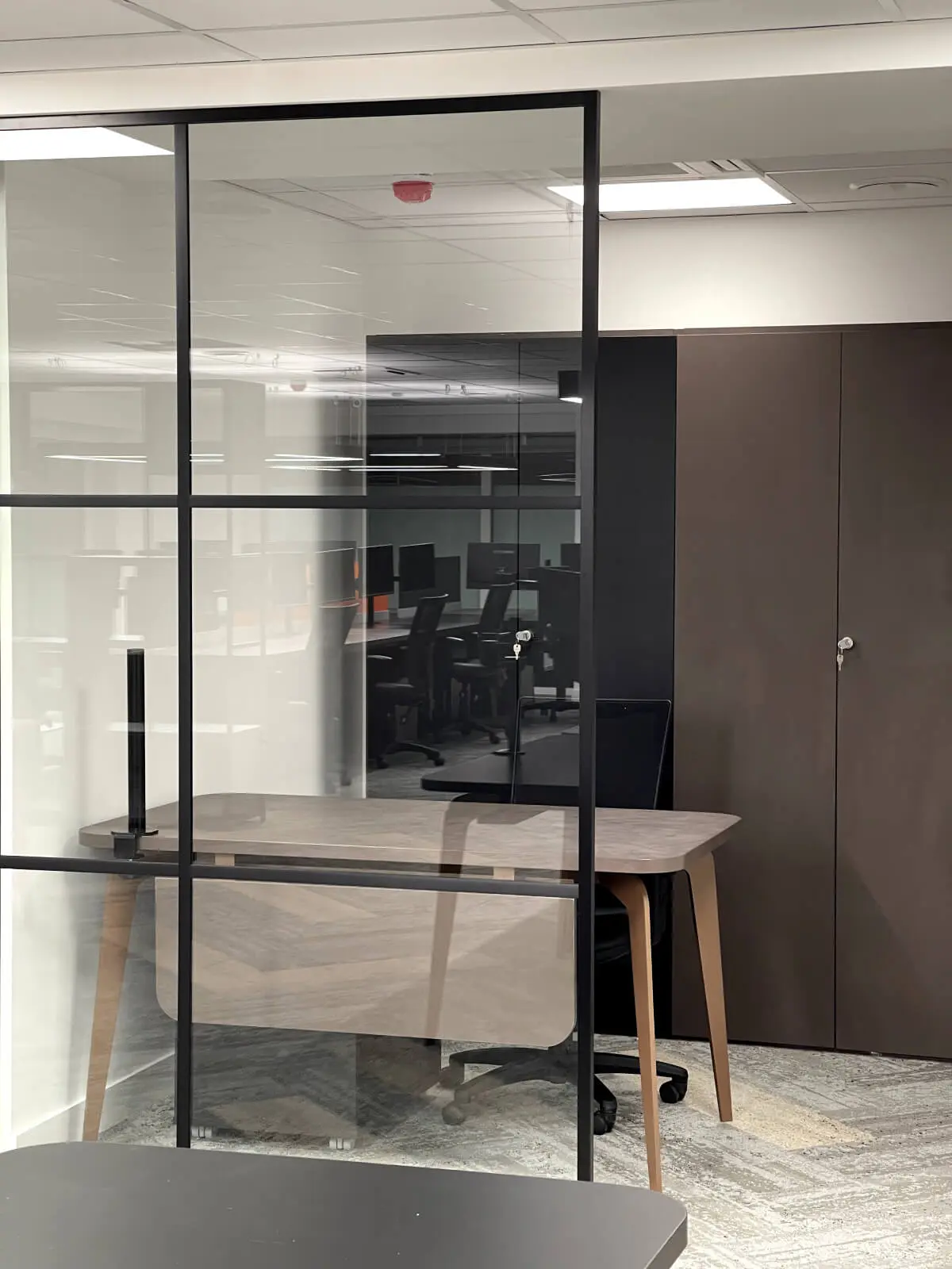 Prideview Properties office space with designer furnitures and black framed glass partitions 71