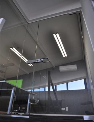 Simon Wang office space with designer furniture, flooring, suspended grid celing and glass partitions 9