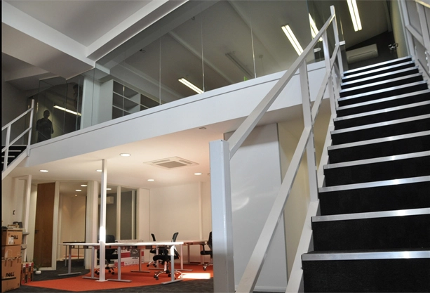 Simon Wang office space with designer furniture, flooring, suspended grid celing and glass partitions 9