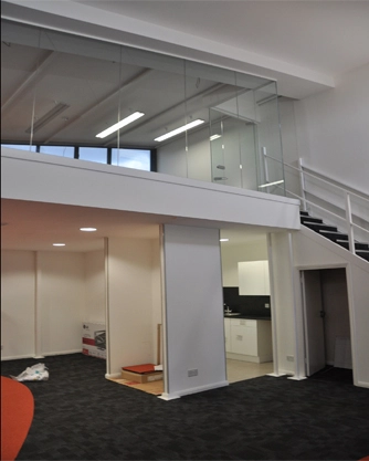 Simon Wang office space with designer furniture, flooring, suspended grid celing and glass partitions 9